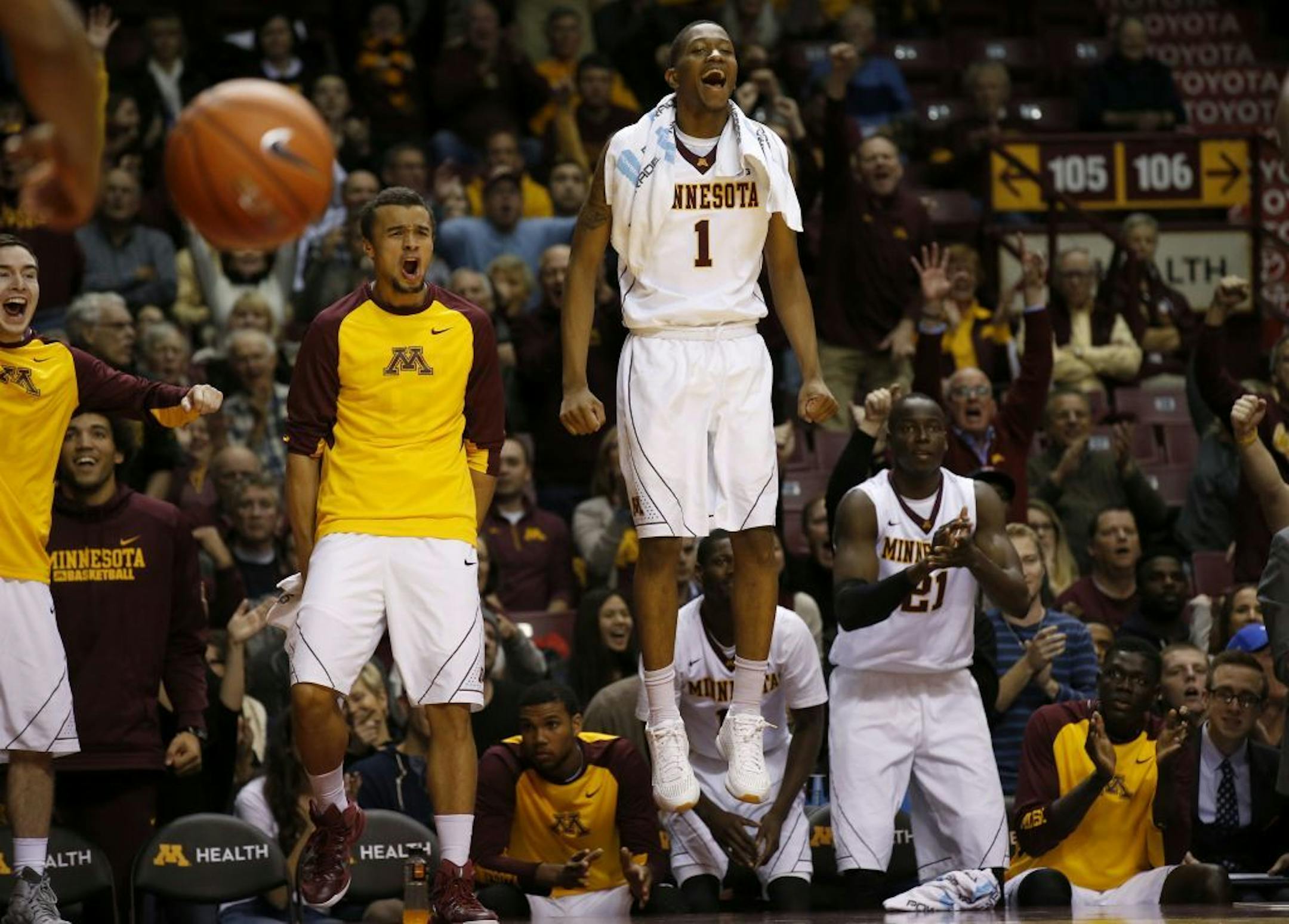 Minnesota guard Dupree McBrayer (1) and teammates cheer their team in the final minute of the second half of an NCAA college basketball game against Clemson.