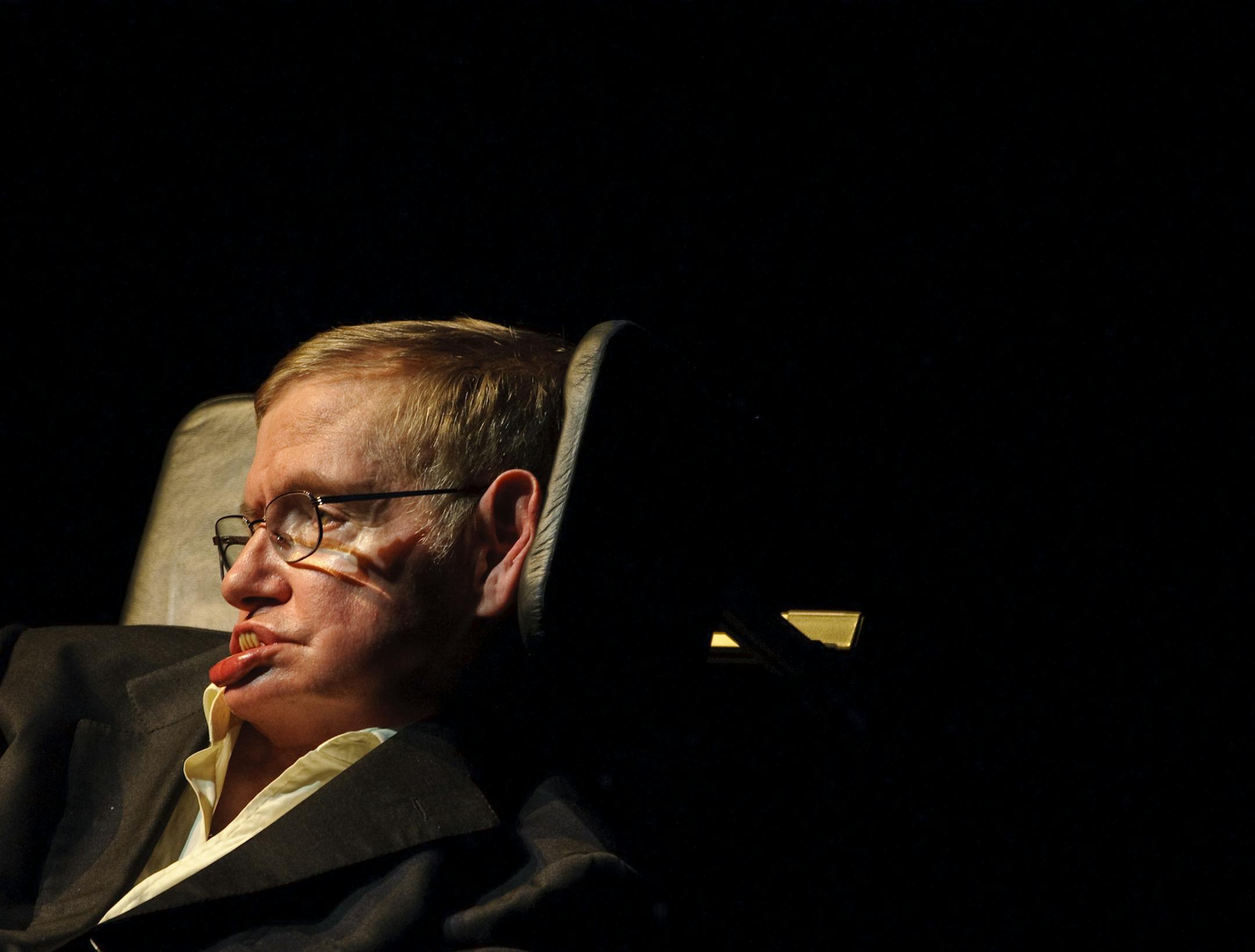 FILE - In this April 5, 2010 file photo, Astrophysicist Stephen Hawking, of England, presents a lecture titled, "Out of a Black Hole" at Texas A&M University in College Station, Texas. Hawking says it is too risky to try to talk to space aliens. Oops. Too late. NASA and others have already beamed several messages into deep space, trying to phone ET. NASA _ which two years ago, broadcast the Beatles song "Across the Universe" across the galaxy _on Wednesday discussed its latest search strategy fo