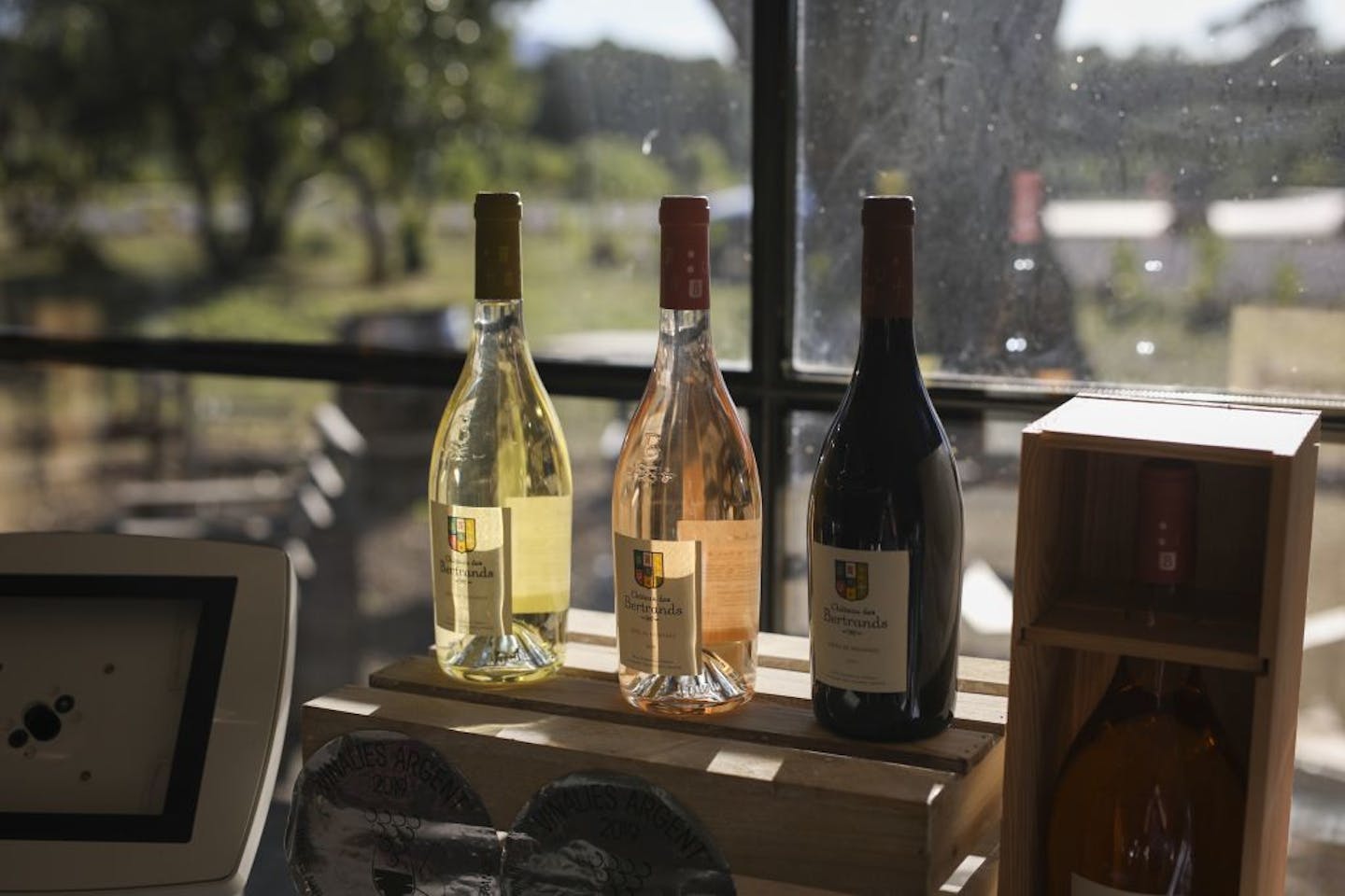 Wine bottles sit in a boutique shop in Le Cannet-des-Maures, in the Provence region, Thursday Oct. 10, 2019. European producers of premium specialty agricultural products like French wine, are facing a U.S. tariff hike on Friday, with dollars 7.5 billion duties on a range of European goods approved by the World Trade Organization for illegal EU subsidies to aviation giant Airbus.