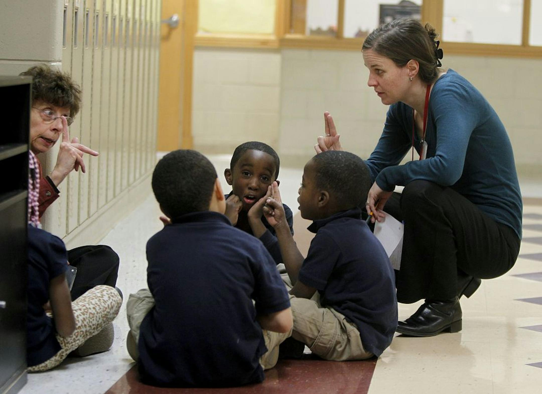 French teacher Theresa Vertuno, left, and school director Tina Maynor taught students the alphabet. "The research for French immersion is that it is a gap-closer," Maynor said. That was an important goal for the district in approving the school, which is similar to a charter school.