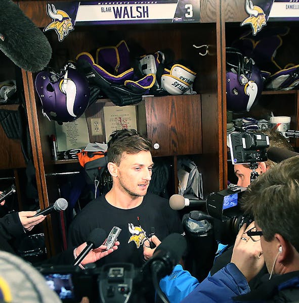 Minnesota Vikings Blair Walsh was surrounded by the media as he made his way to his locker at Winter Park, Monday, January 11, 2016 in Eden Prairie, M