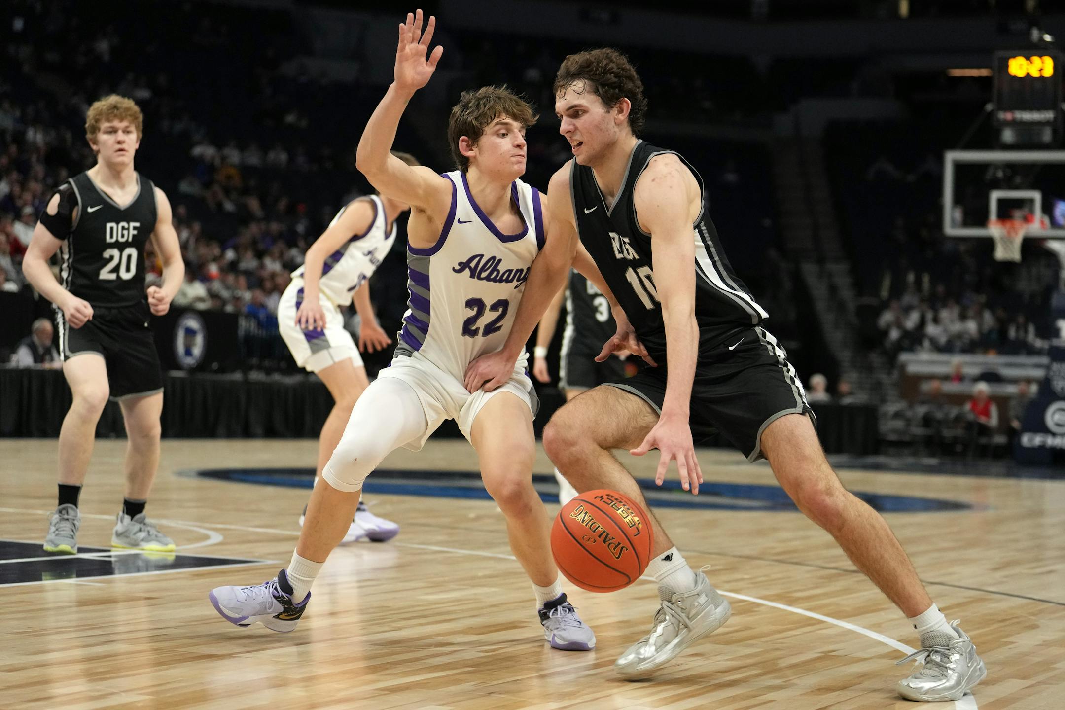 DGF guard Owen Leach (10) drives to the basket as Albany guard Tysen Gerads (22) defends in the second half.