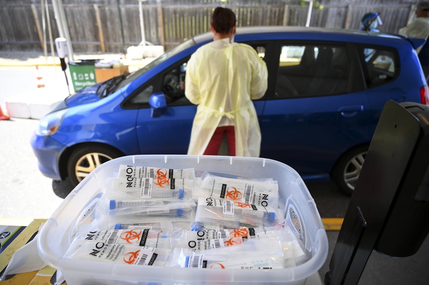 COVID-19 testing kits in a plastic bin at North Memorial Health's drive-up testing facility in Robbinsdale on Wednesday.