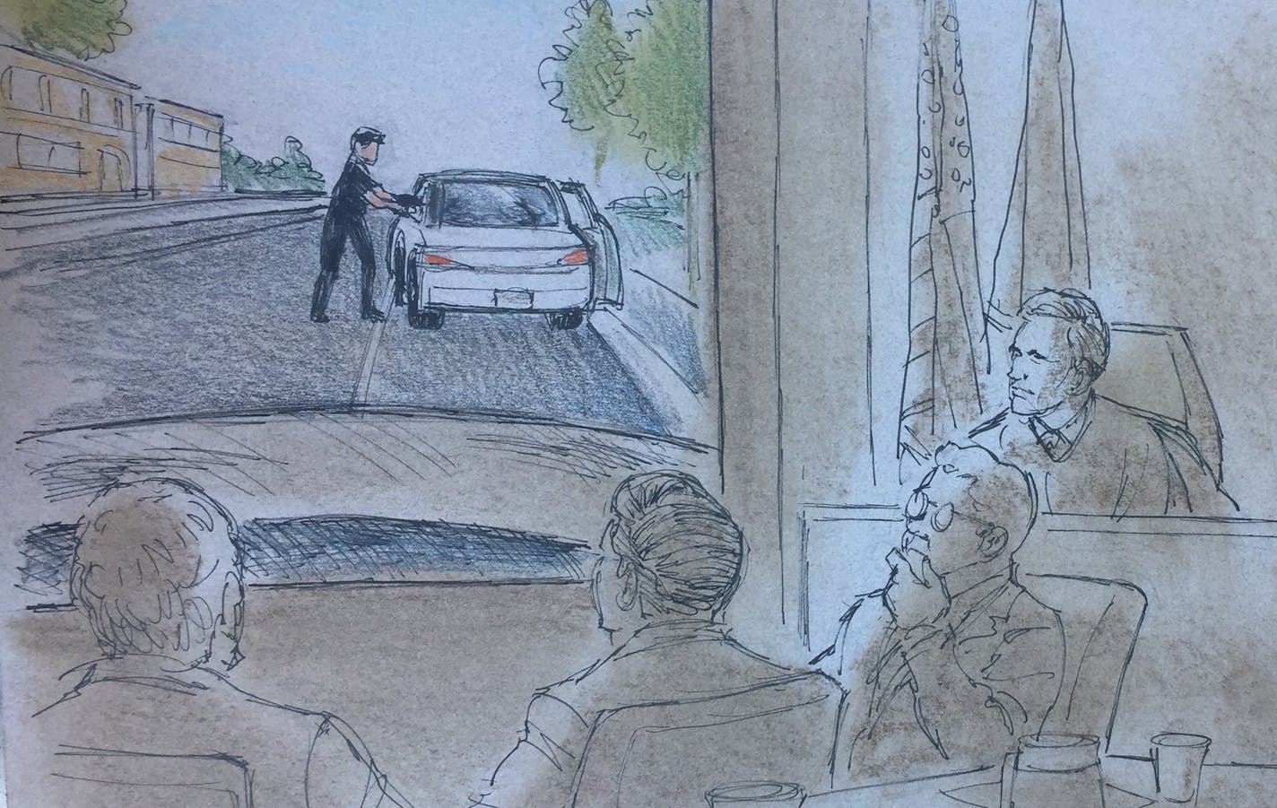 Jeronimo Yanez and his defense team look on at dashcam footage played during Assistant Ramsey County Attorney Richard Dusteroft during opening argument's for Yanez's trial in the fatal shooting of Philando Castile.