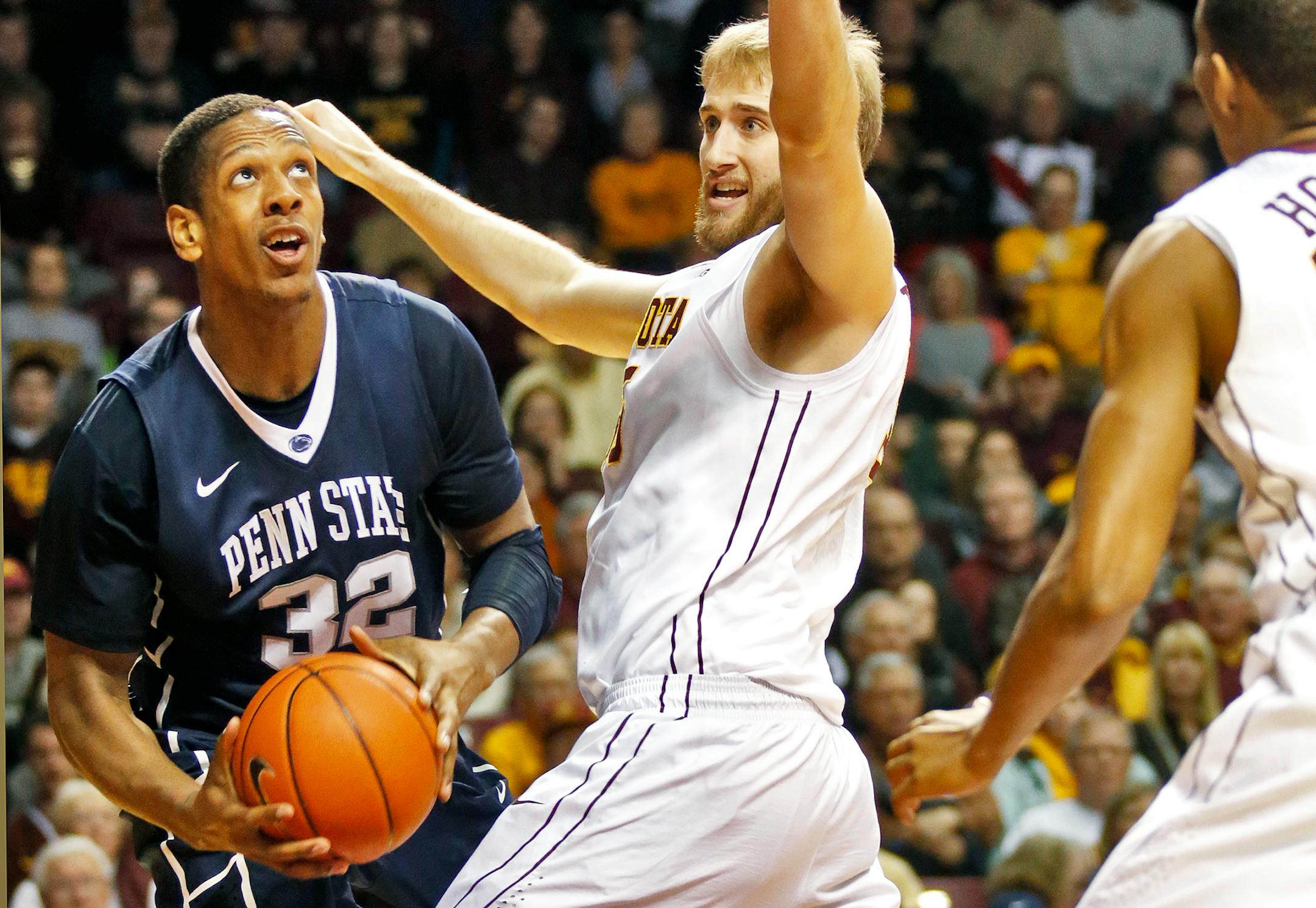 Gophers center Elliott Eliason tries to cut off Penn State's Jordan Dickerson.