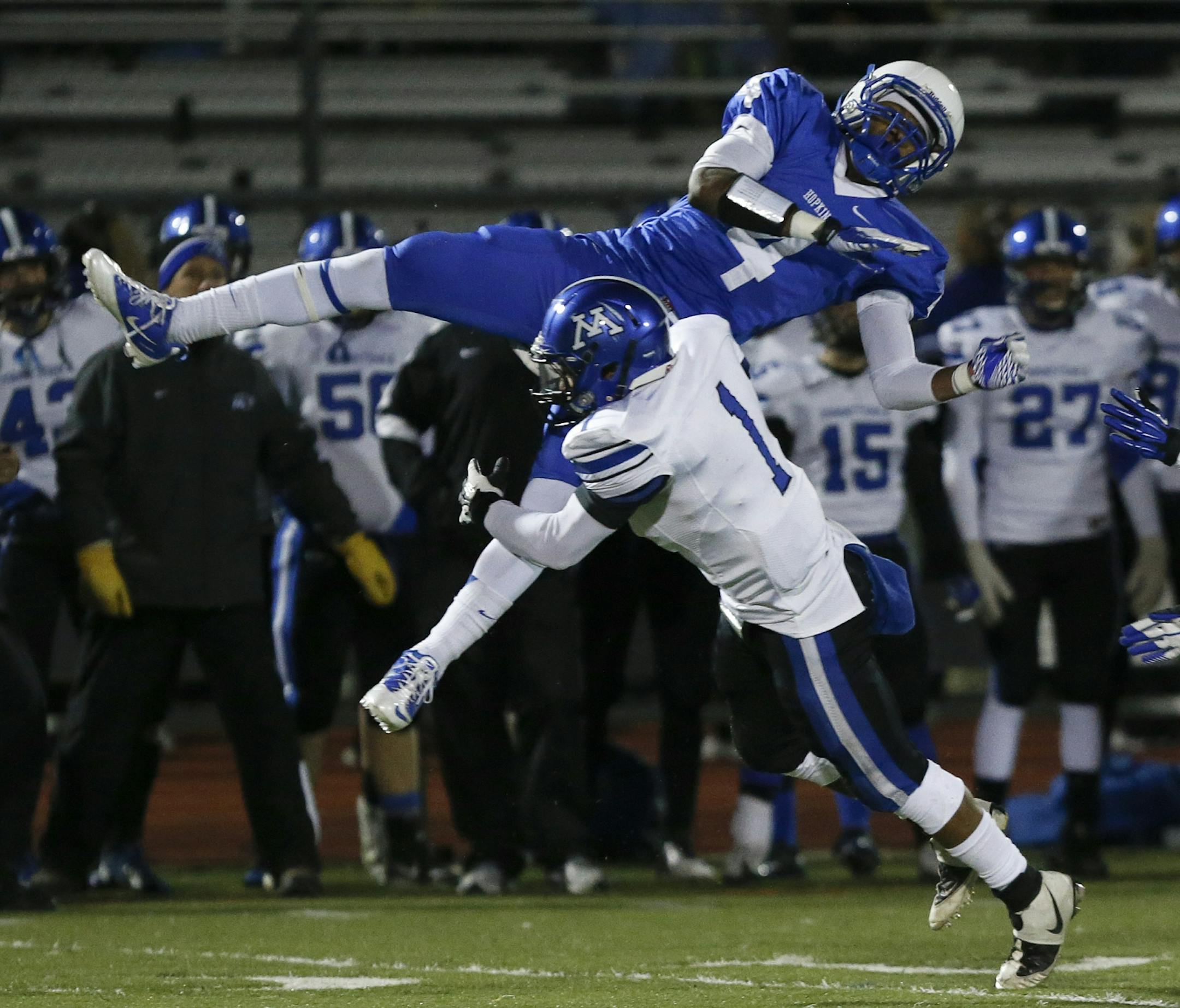 Minnetonka DeCeon Schumann hit Hopkins Ricky Johnson jhard as he attempted to make a catch during first half of the Class 6A playoffs in Minnetonka, Min., Friday October 26, 2012.