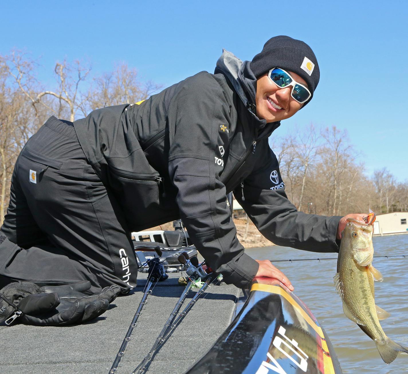 Trevor Lo of St. Paul with a dandy largemouth bass caught while practice fishing Wednesday for the Bassmaster Classic on Grand Lake, Okla. Five fish can be weighed in the three-day contest, with a first place prize of $300,000.