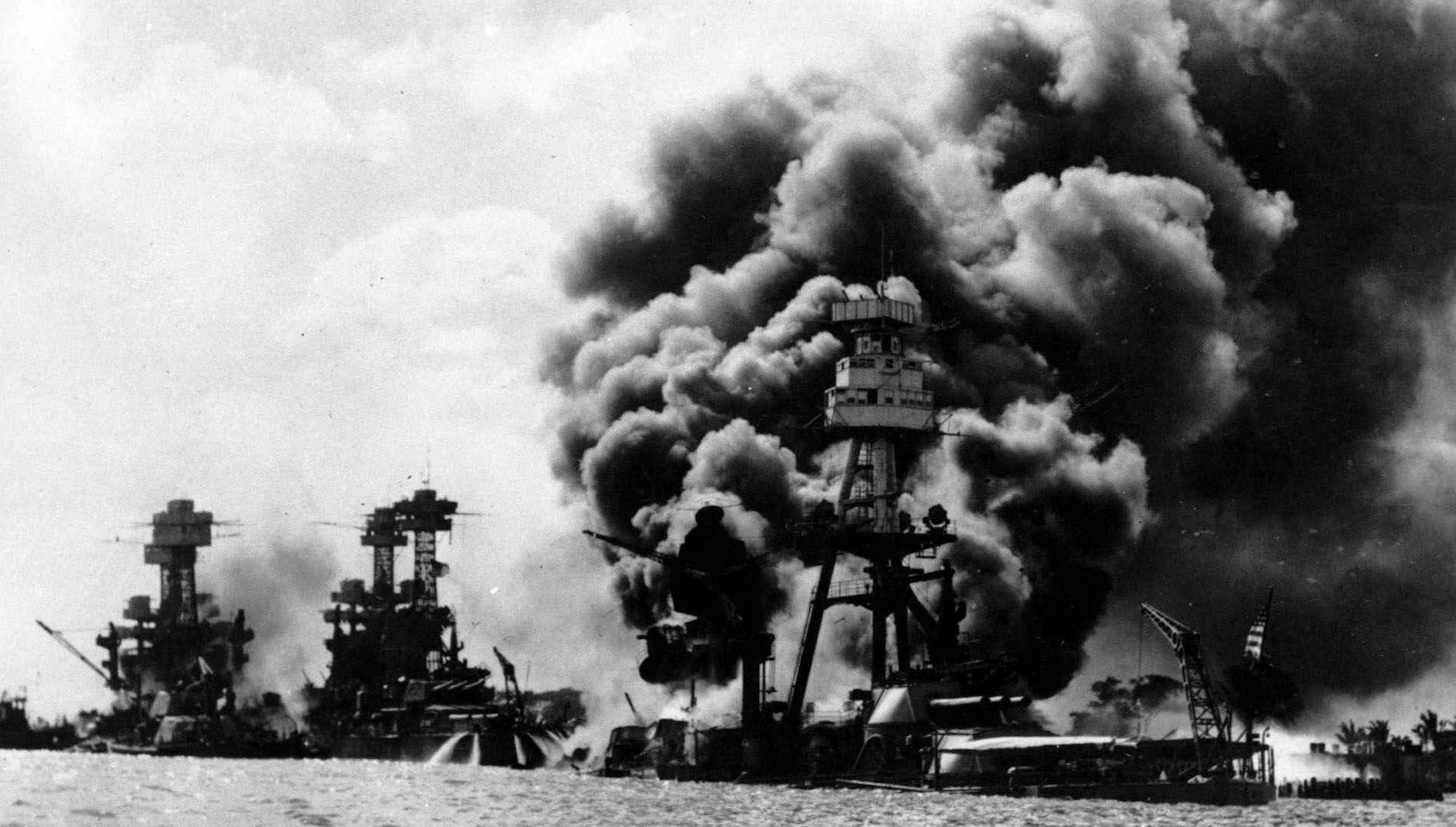 FILE--Three U.S. battleships are hit from the air during the Japanese attack on Pearl Harbor in this Dec. 7, 1941 file photo. From left are: USS West Virginia, USS Tennessee, both damaged; and USS Arizona, sunk. The terrorist assualts that occured Tuesday, Sept. 11, 2001, on the World Trade Center and at the Pentagon reminded many Pearl Harbor survivors of the 1941 Japanese attack on U.S. warships in Hawaii. (AP Photo/File) ORG XMIT: NY17