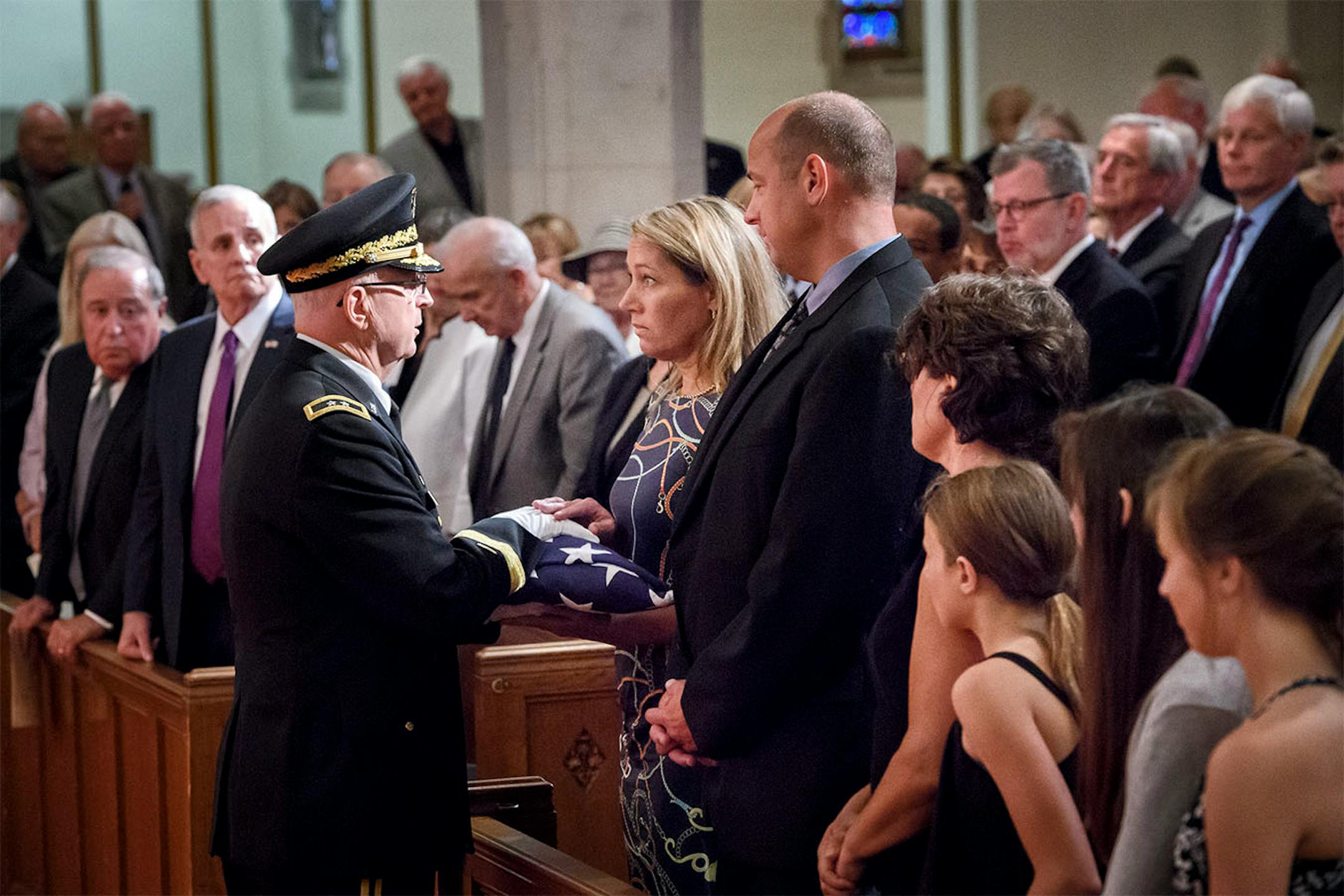 Minnesota National Guard Major General Rick Nash presented an American Flag to former Gov. Wendell Anderson's daughter Amy for Anderson's service in the Army and as Commander of the Guard.
