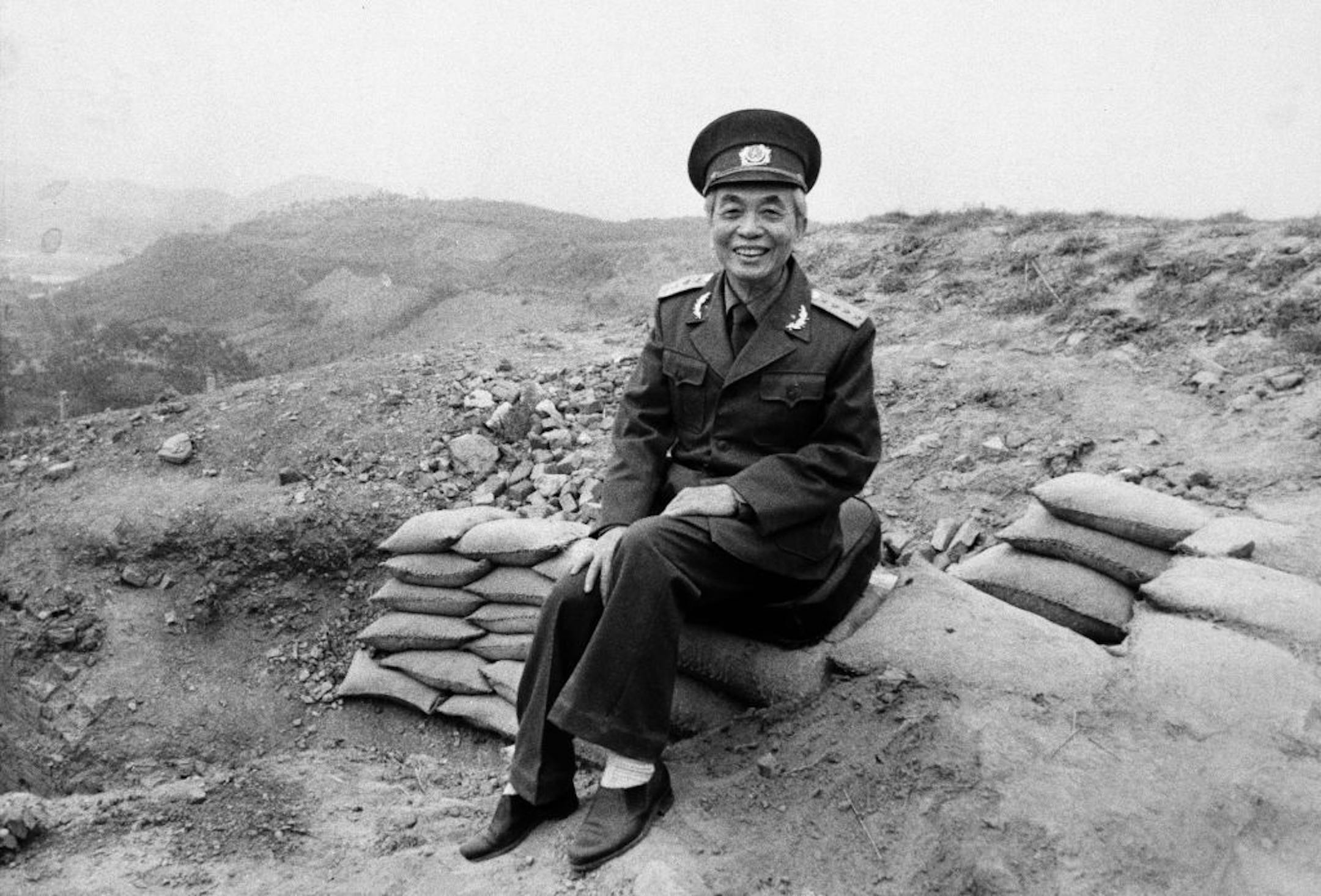 FILE - In this May 4, 1984 file photo, Vietnamese Gen. Vo Nguyen Giap sits on top of the remains of a French bunker in Dien Bien Phu, Vietnam, prior to the May 7 celebrations of the anniversary of the Vietnamese victory over the French.