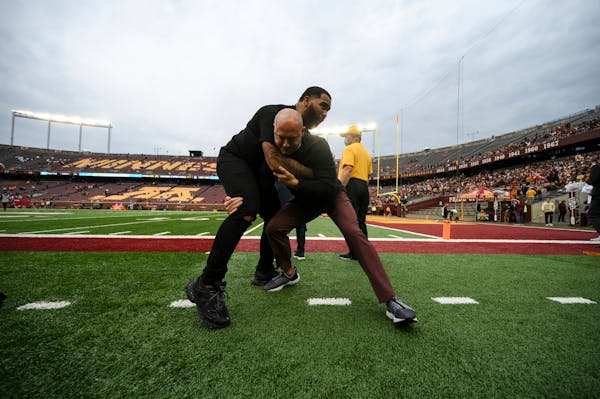 Olympic wrestler gable Steve wrestled with Gophers football coach P.J. Fleck when Steveson attended the game against Ohio State last week..