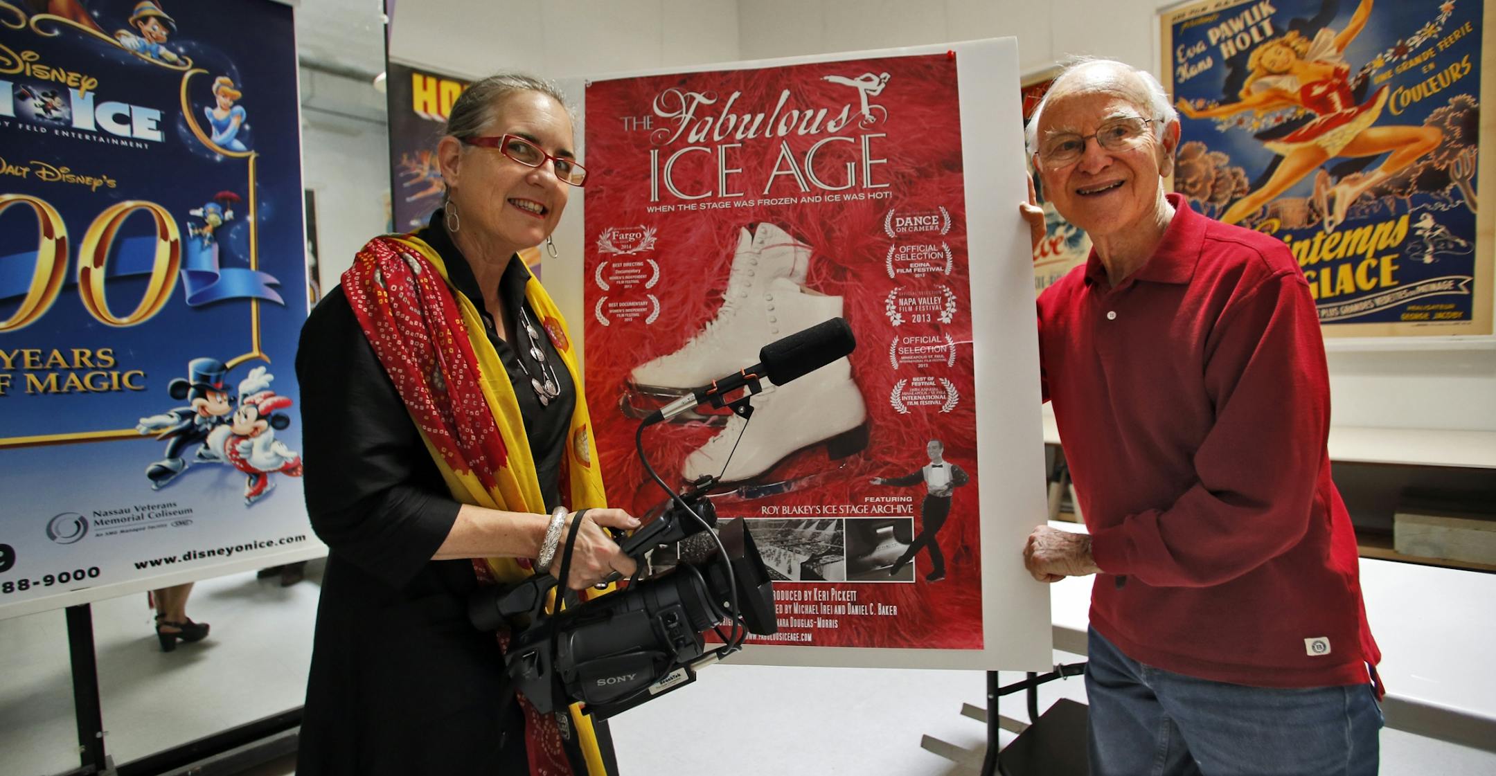Keri Pickett, left, and Roy Blakey with collectable posters.