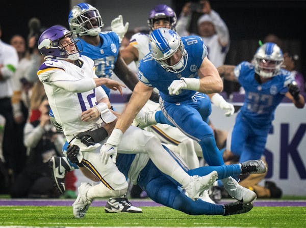 The Lions defense forced Minnesota Vikings quarterback Nick Mullens (12) to throw and incomplete pass in the second quarter at U.S. Bank Stadium in Mi