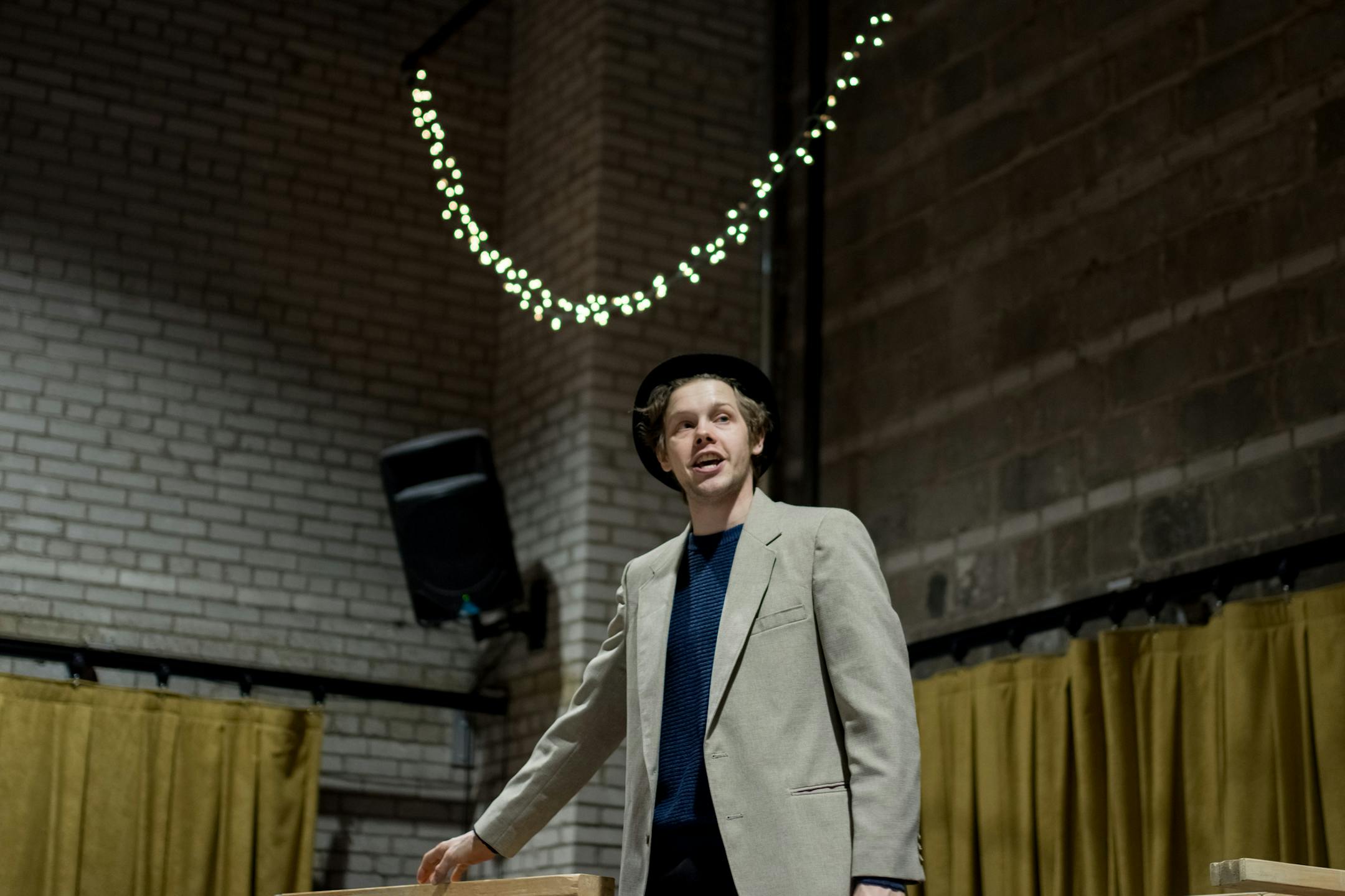 Theater Latte Da's performance of "Assassins."
Tyler Michaels as the Baladeer / Lee Harvey Oswald.
Photo by Emilee Elofson