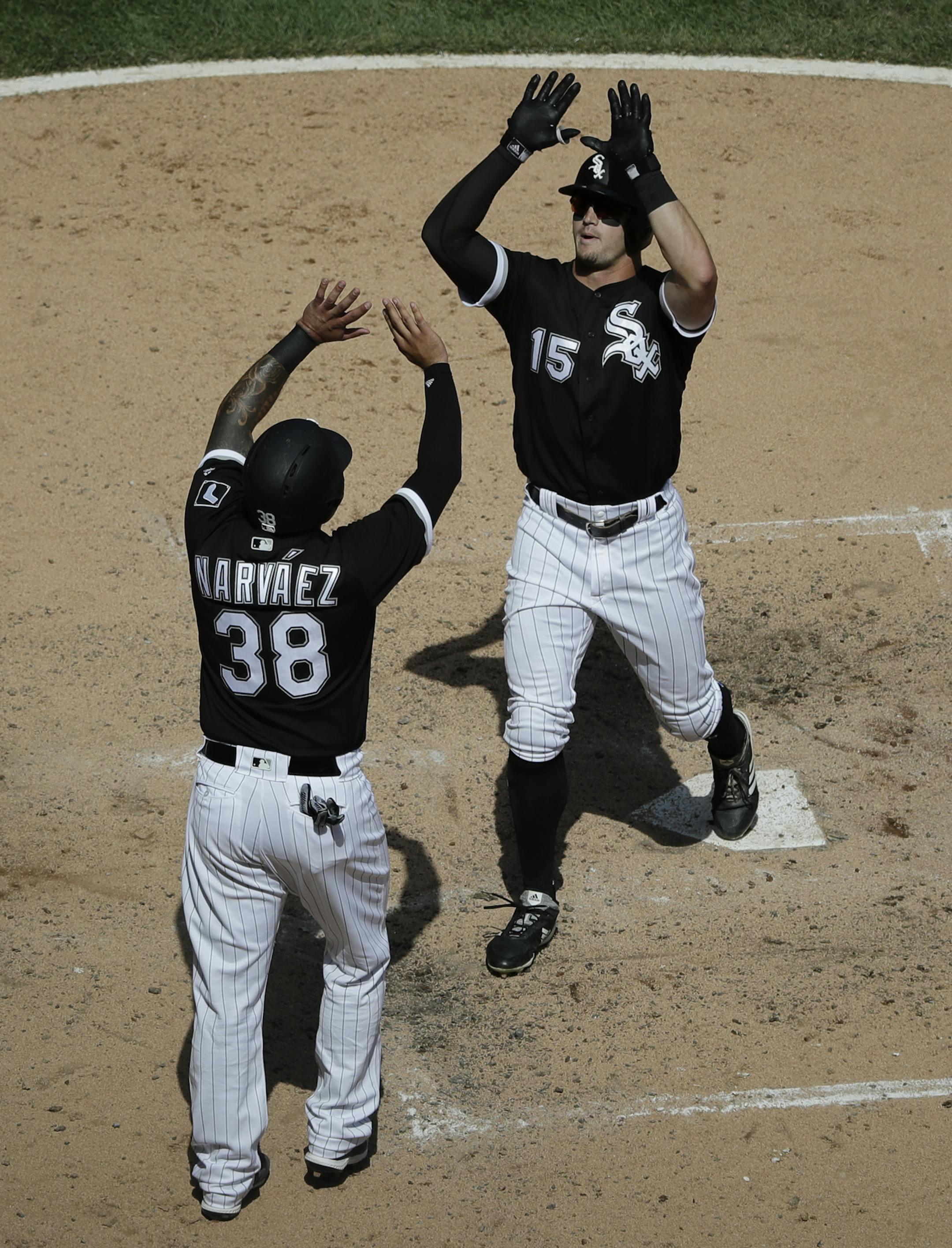 Chicago White Sox's Adam Engel, right, celebrates with Omar Narvaez after hitting a two-run home run against the Minnesota Twins during the fifth inning of a baseball game Wednesday, Aug. 22, 2018, in Chicago. (AP Photo/Nam Y. Huh)