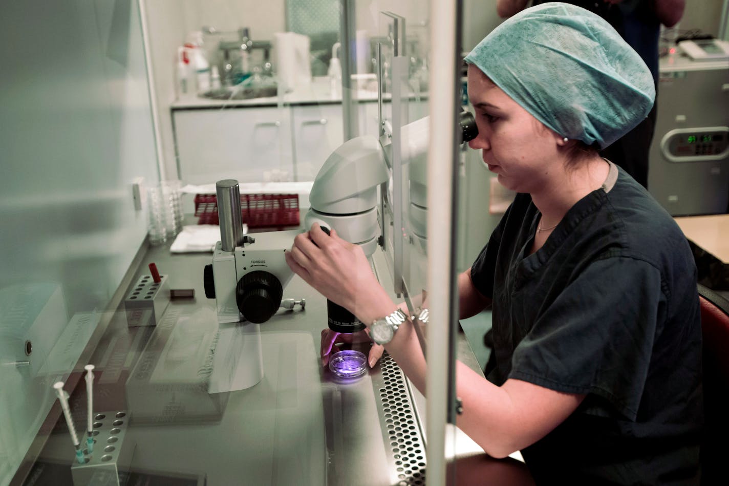 An embryologist works on an embryo at a fertility clinic.