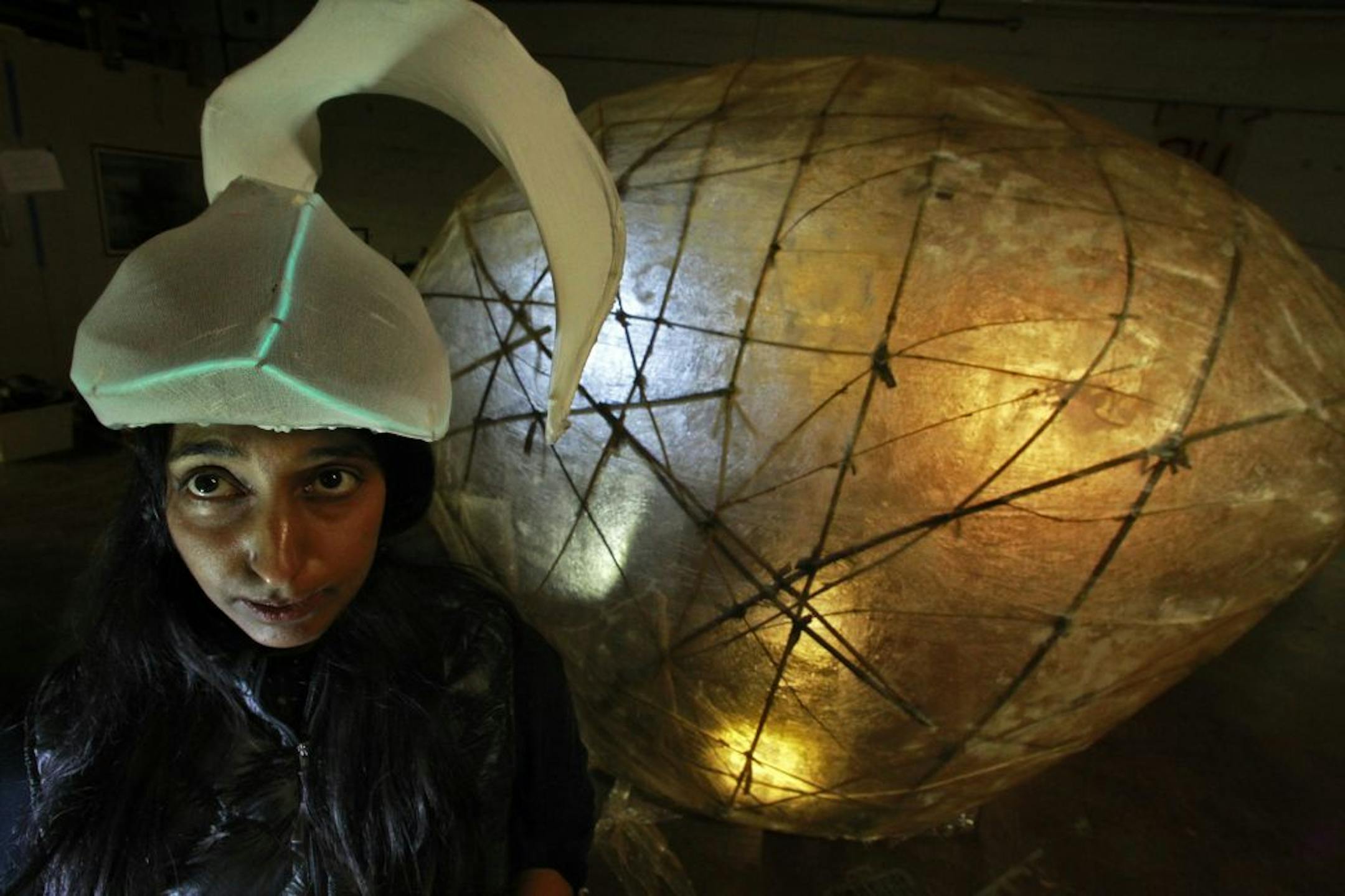 Janaki Ranpura wears a "sperm helmet" in front of the egg.