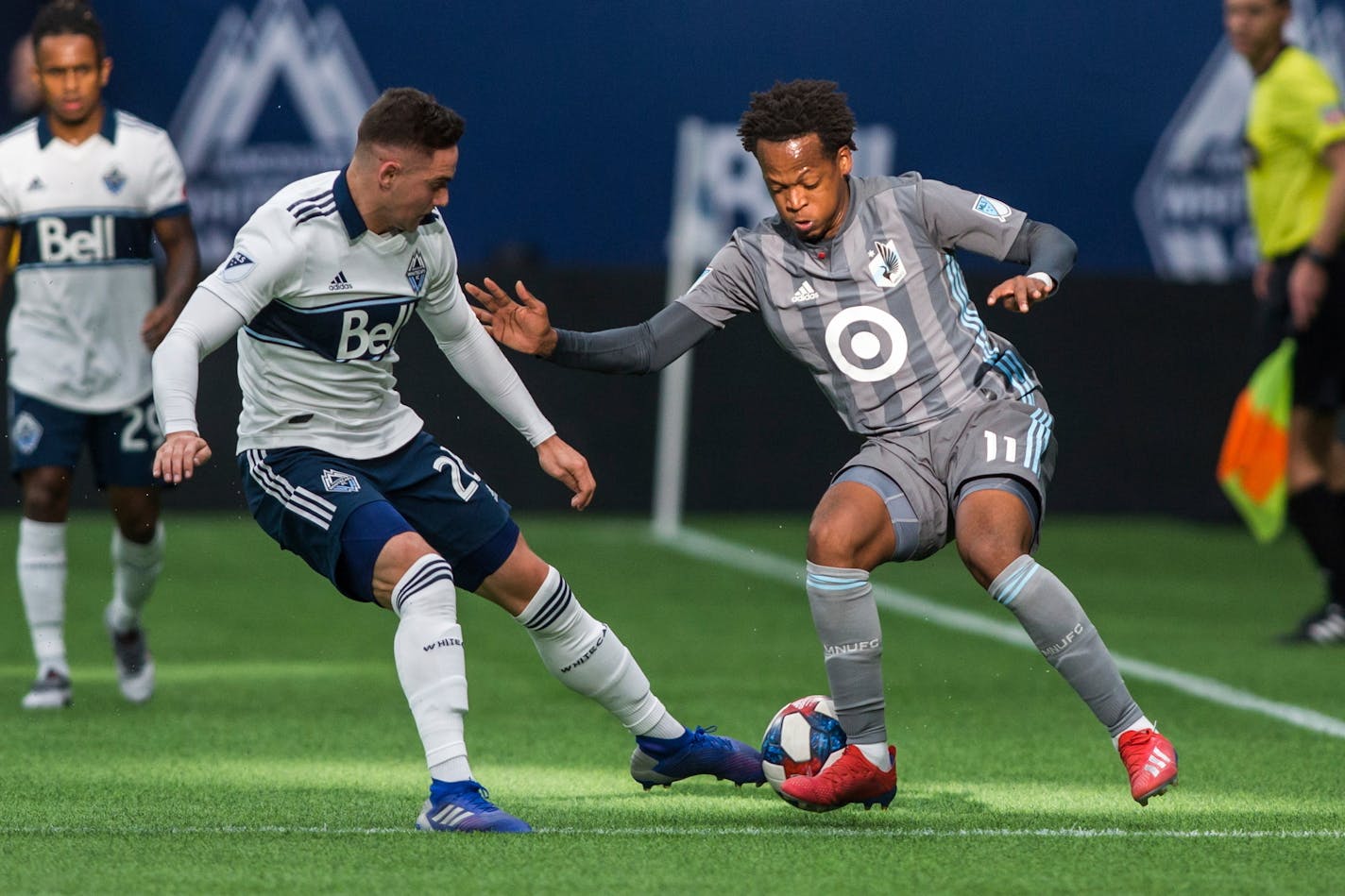 The Whitecaps' Jake Nerwinski plays the ball against Minnesota United's Romario Ibarra during the first half