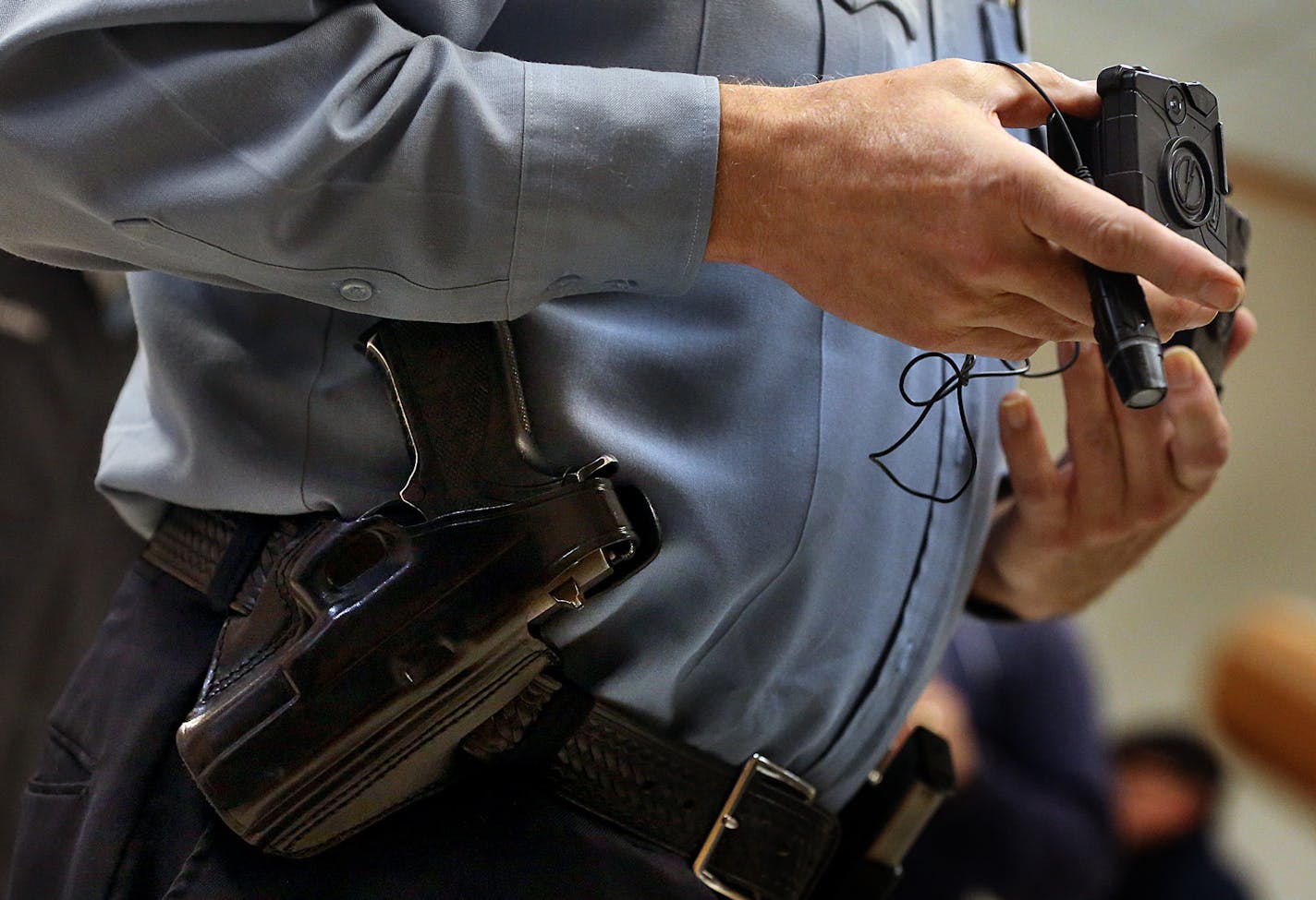 Minneapolis Police Lt. Greg Reinhardt displayed two of the body cameras that will be tested by the department. Both cameras will record 9.5 hours of video (non HD) and are mad by Taser. One camera attaches to an officer&#x201a;&#xc4;&#xf4;s body and is completely self-contained, while the other offers a more flexible option, with a thinner camera attached to a battery. ] JIM GEHRZ &#x201a;&#xc4;&#xa2; jgehrz@startribune.com / Minneapolis, MN / November 7, 2014 / 1:00 PM / BACKGROUND INFORMATION: