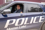 Chad Pattison, the last police officer in Moose Lake, poses for a portrait Tuesday, Feb. 06, 2024, outside the Moose Lake Police Station in Moose Lake