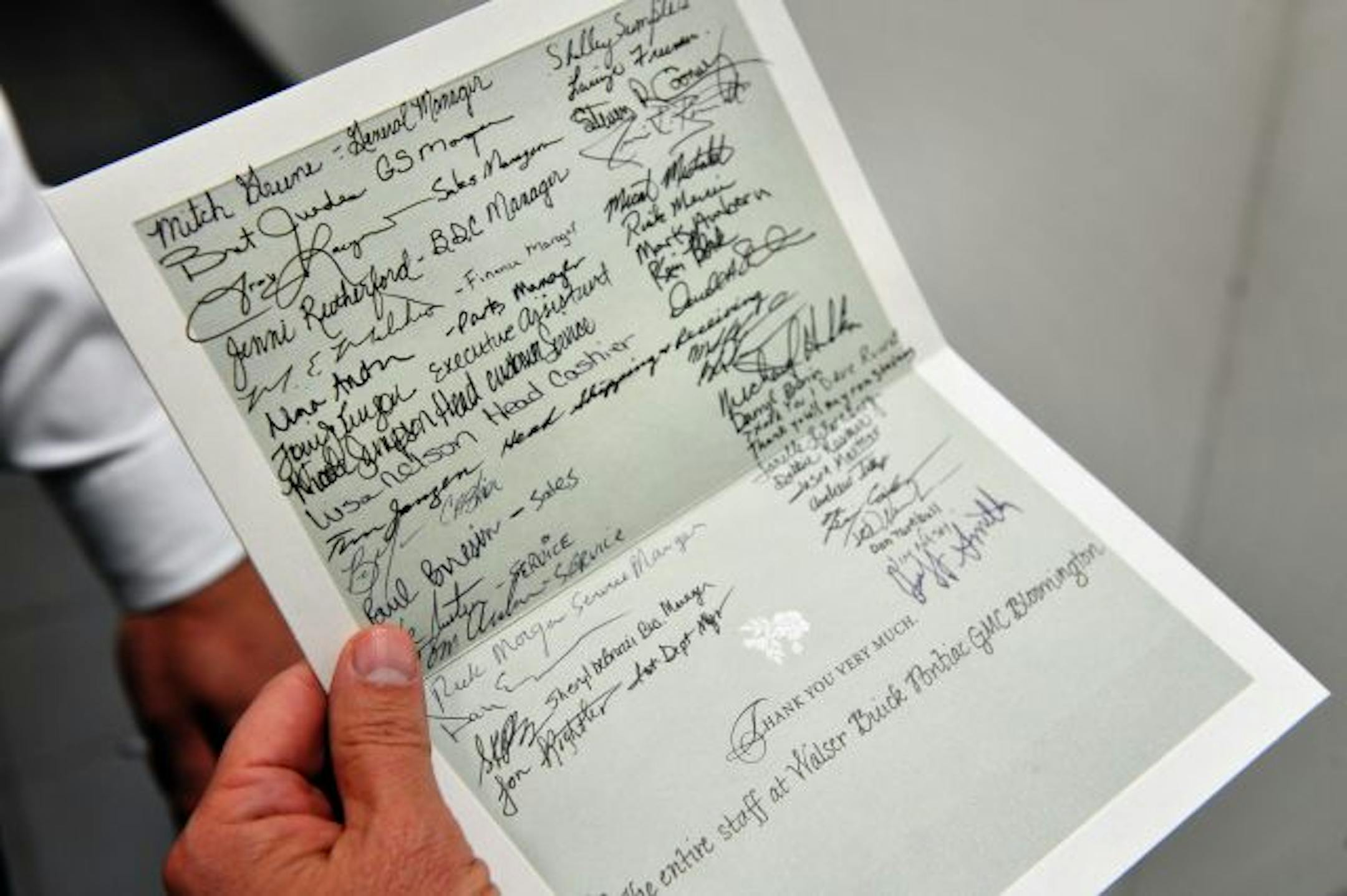 GLEN STUBBE � gstubbe@startribune.com -- Tuesday, June 9, 2009 -- Bloomington, Minn. -- Paul Walser read a thank you card for Senator Amy Klobuchar, signed by all the employees of his Bloomington GM dealership. With the help of Senator Amy Klobuchar, Walser sucessfully lobbied General Motors to keep his dealership open.