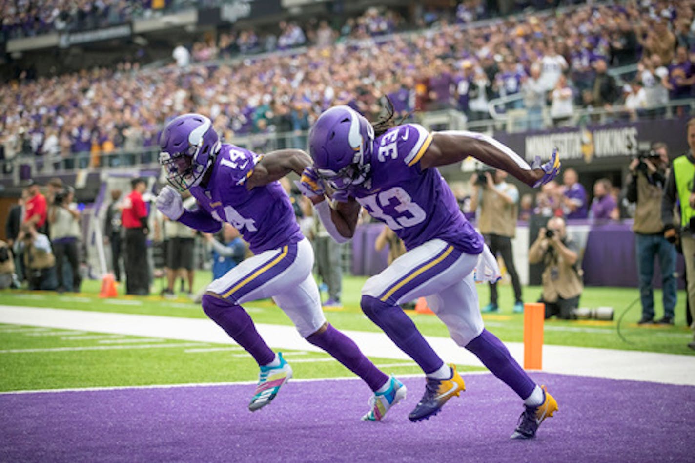 Minnesota Vikings wide receiver Stefon Diggs, left, and running back Dalvin Cook, right, celebrate Diggs' 52-yard touchdown with a sprint in the end zone in the second quarter against the Philadelphia Eagles on Sunday, Oct. 13, 2019 at U.S. Bank Stadium in Minneapolis, Minn. (Elizabeth Flores/Minneapolis Star Tribune/TNS) ORG XMIT: 1459820