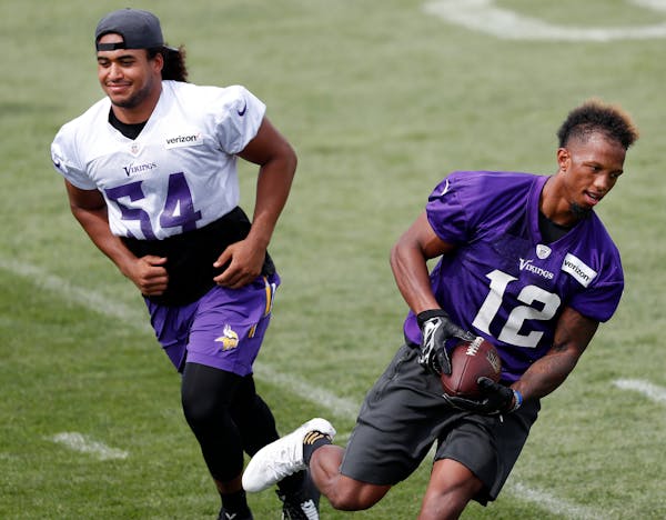 Linebacker Eric Kendricks (54, shown with receiver Chad Johnson) was singled out by Vikings coach Mike Zimmer as being much more comfortable than he w