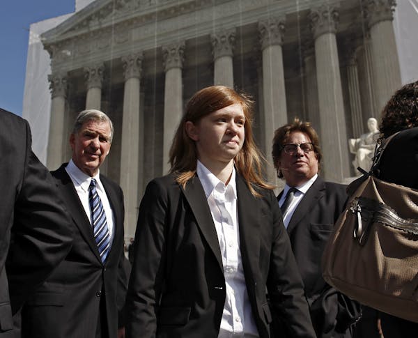 FILE -- Abigail Fisher waits in front of the Supreme Court to speak to the media after the Justices heard the arguments surrounding the affirmative ac