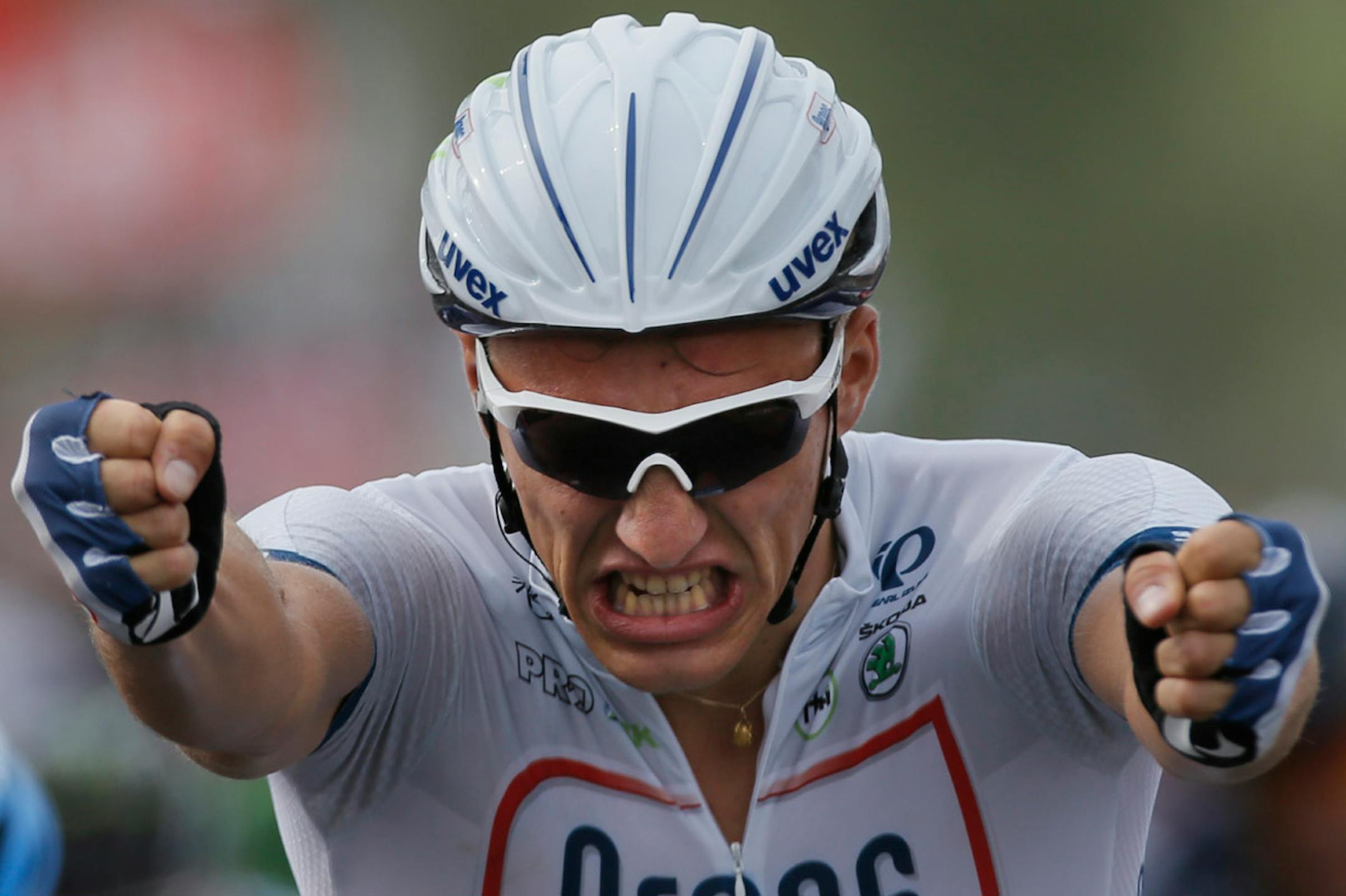 Marcel Kittel of Germany celebrates as he crosses the finish line to win the first stage of the Tour de France