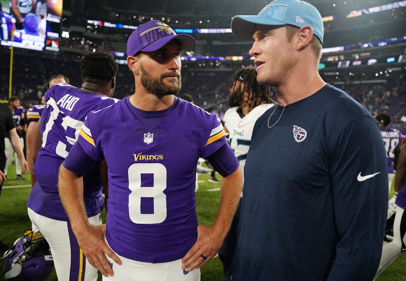 Minnesota Vikings quarterback Kirk Cousins (8) talks with Tennessee Titans quarterback Ryan Tannehill (17) on the field following an NFL preseason game between the Minnesota Vikings and the Tennessee Titans Saturday, Aug. 19, 2023 at U.S. Bank Stadium in Minneapolis. ] ANTHONY SOUFFLE • anthony.souffle@startribune.com