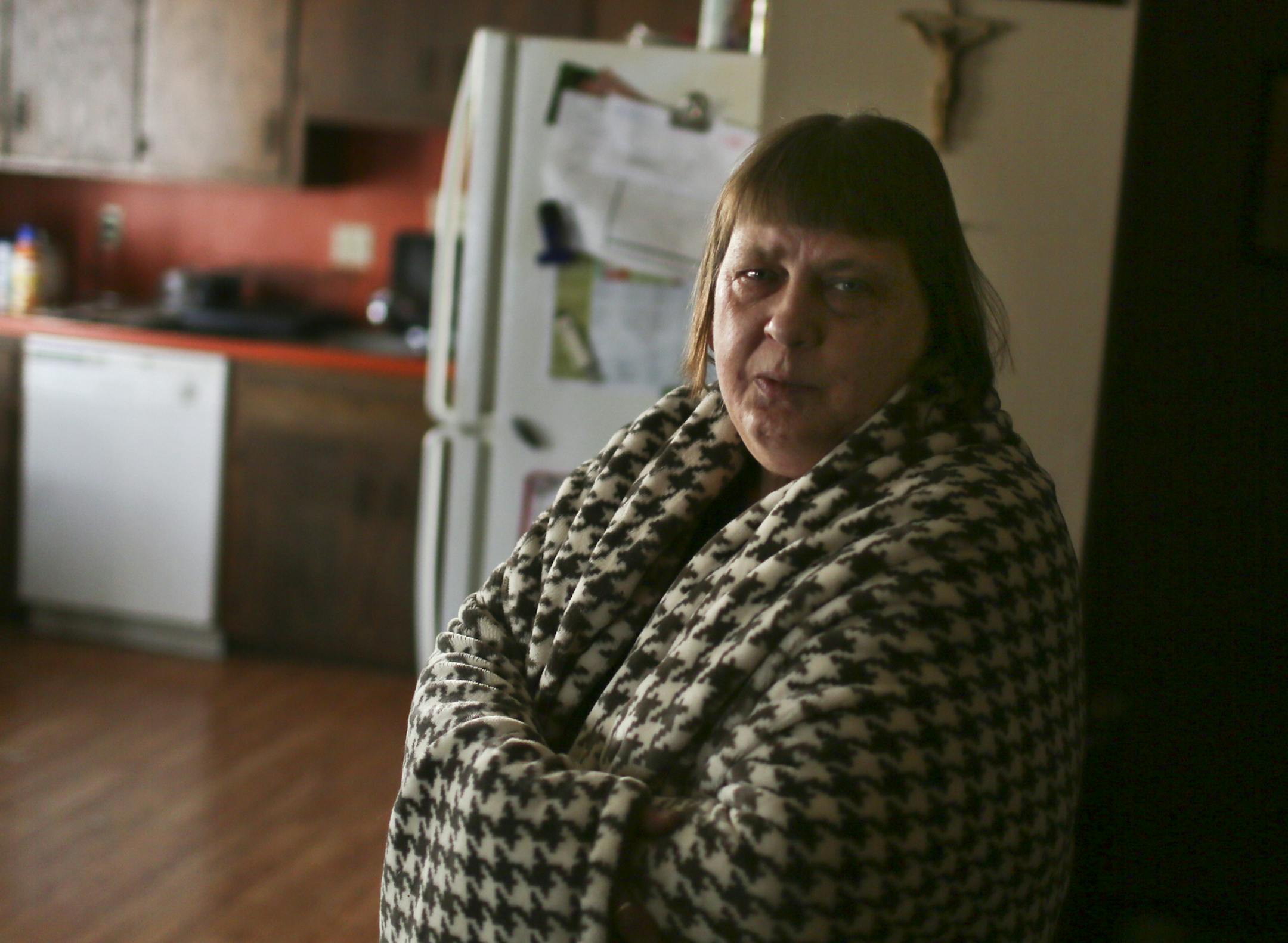 During this unseasonably cold winter Vicki Parchman, 55, has often wrapped herself in a blanket to stay warm and there are multiple blankets folded on the couch waiting for other family members and visitors. Parchman, who keeps her heating thermostat at 65 degrees or below, receives $200 a year in heat fuel assistance but her heating bill for December and January was $300. Parchman said she could afford to send off only $120 on that bill. "It's just scary," Parchman said about the heating bills.