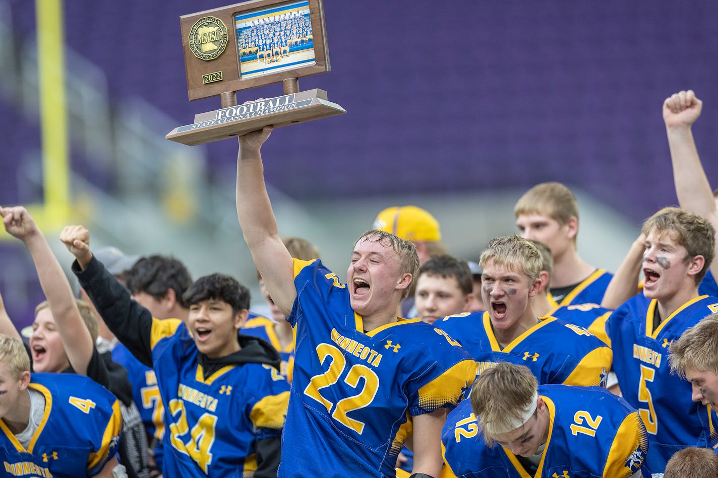 Minneota's team celebrated their 38-21 win over Springfield in the Class A division of the Minnesota Prep Bowl at U.S. Bank Stadium, in Minneapolis, Minn., on Friday, Dec. 2, 2022. ] Elizabeth Flores • liz.flores@startribune.com