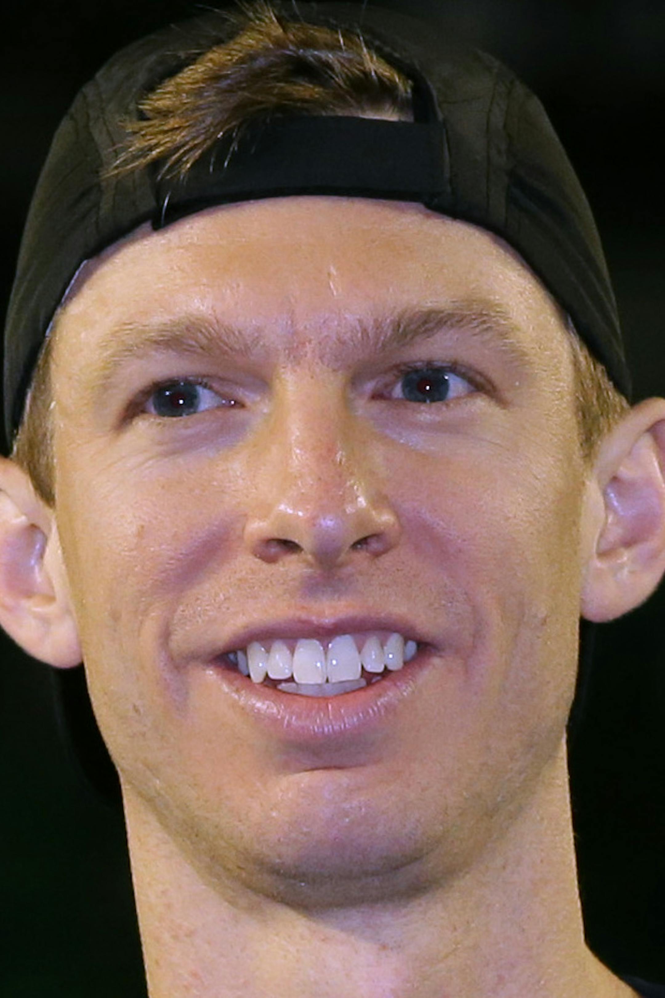 Runners-up Eric Butorac of the U.S., left and Raven Klaasen of South Africa hold the trophy after their men's doubles final against Lukasz Kubot of Poland and Robert Lindstedt of Sweden, at the Australian Open tennis championship in Melbourne, Australia, Saturday, Jan. 25, 2014.(AP Photo/Aaron Favila)