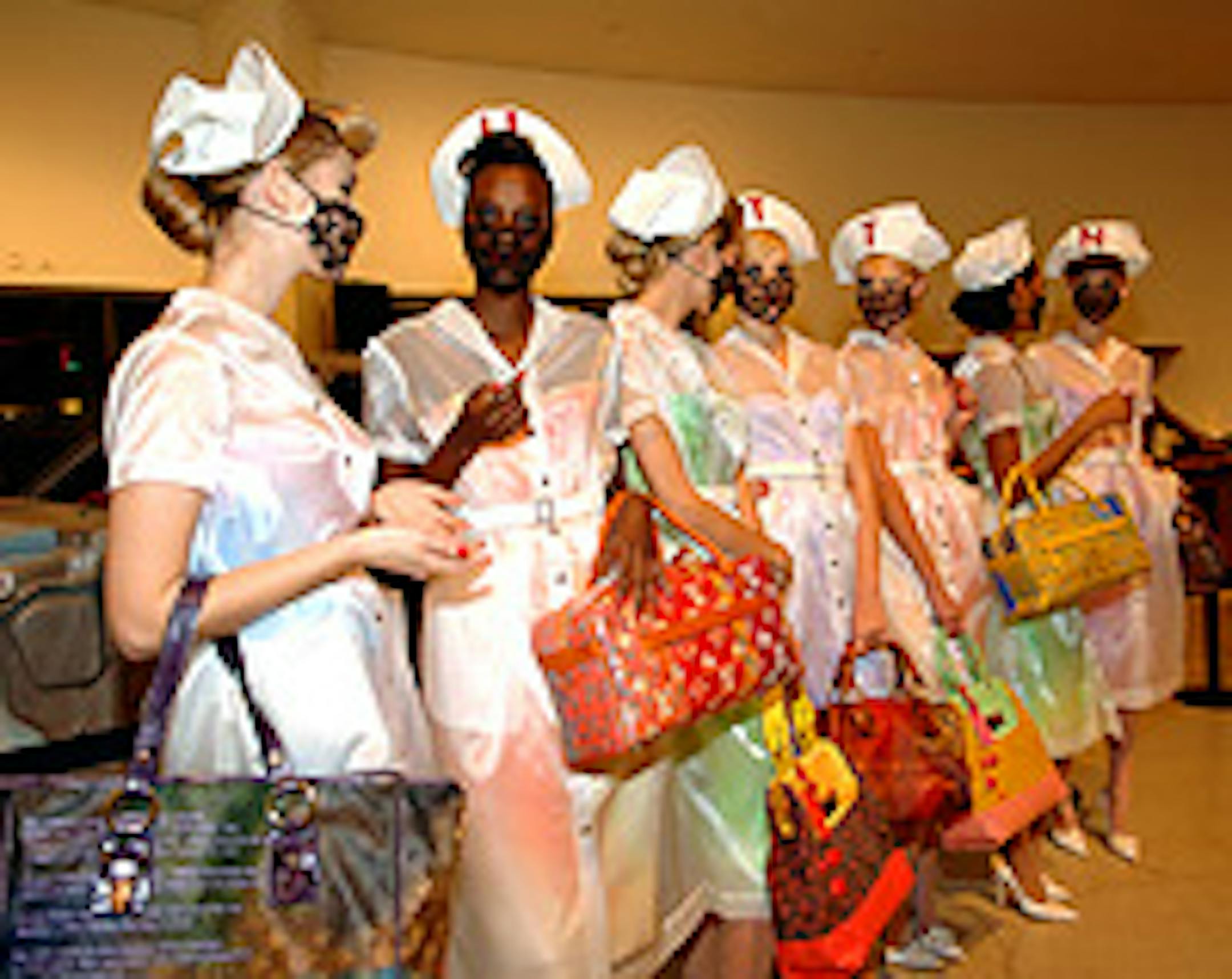 Models carried Louis Vuitton bags designed by Richard Prince at the reception celebrating Prince's exhibition at the Guggenheim.