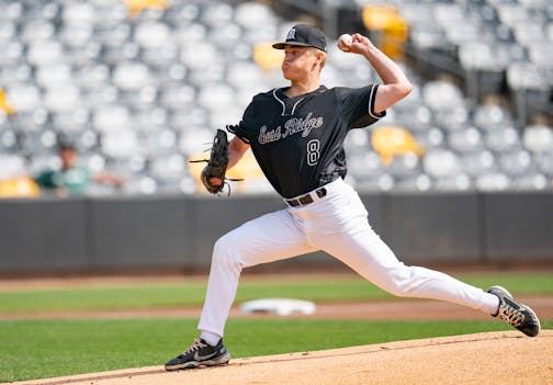 East Ridge starting pitcher Maxwell Arlich (8) throws out the first pitch of the game against Lakeville South in the first inning of a 4A quarterfinals game.