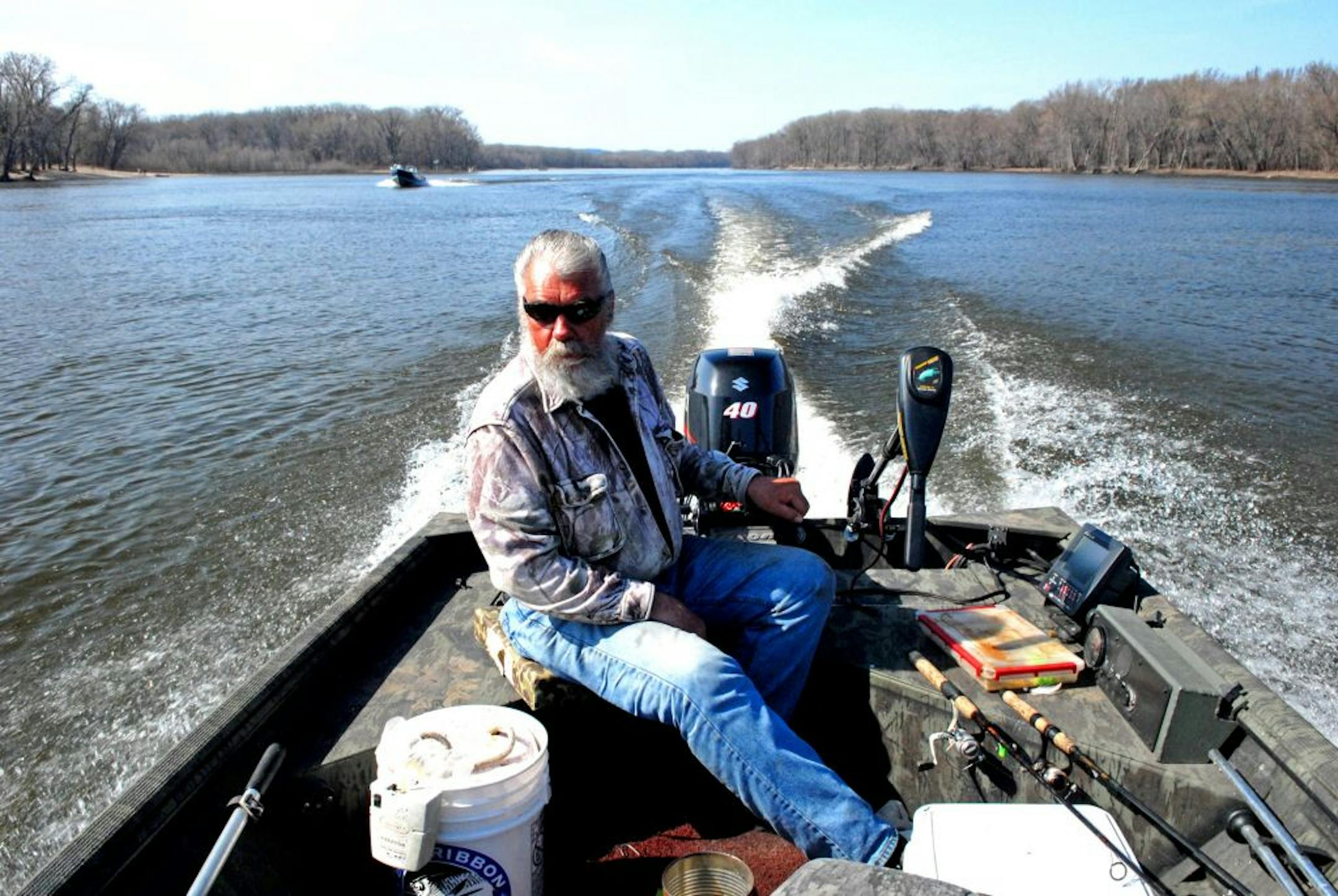 Fishing guide Dick "Griz'' Grzywinski of St. Paul on the Mississippi River on Wednesday, a March day when the temperature hovered around 70 degrees and the fish bit.