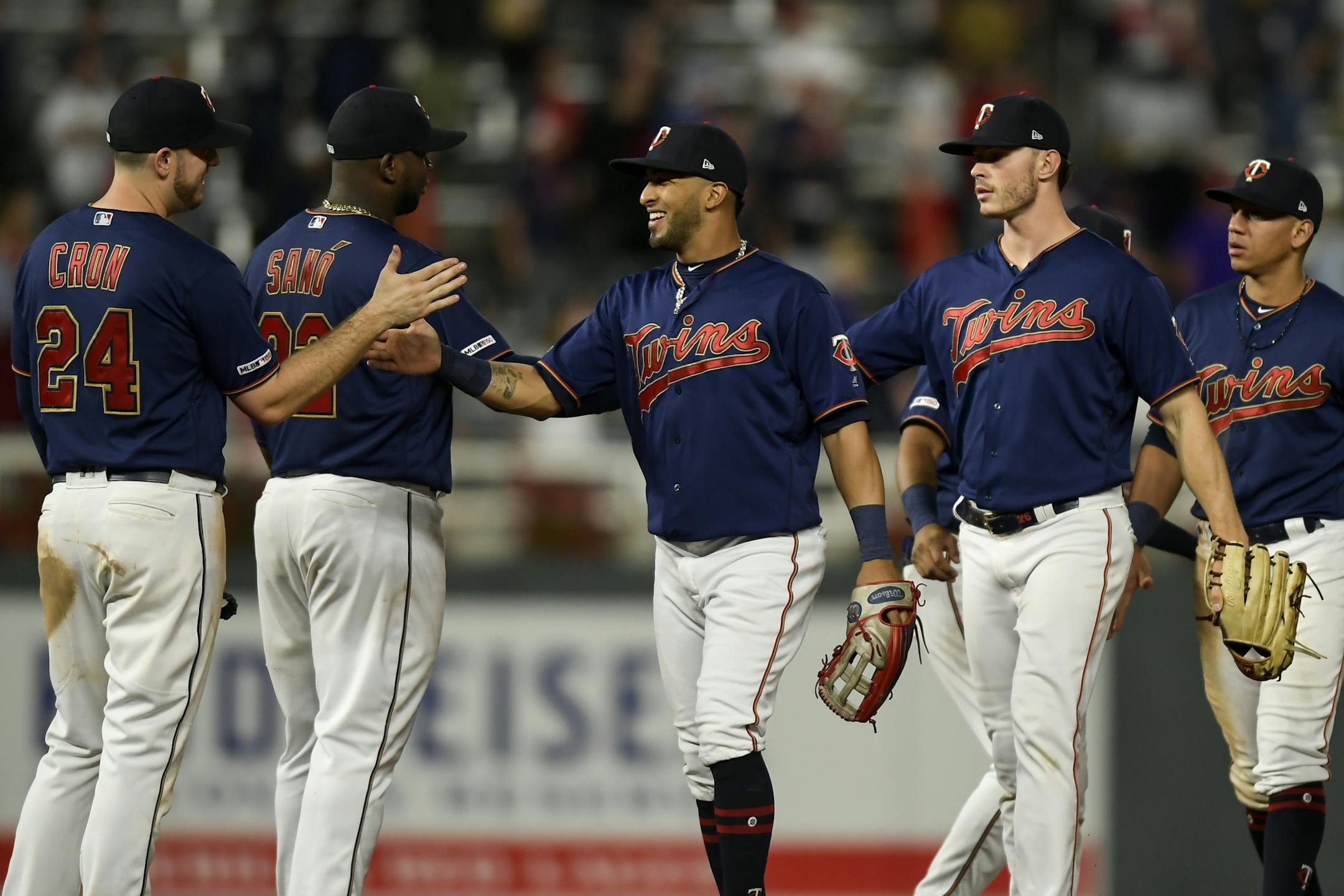 Minnesota Twins players, including left fielder Eddie Rosario (20), center, celebrated their 4-1 win over the Cleveland Indians Saturday night.