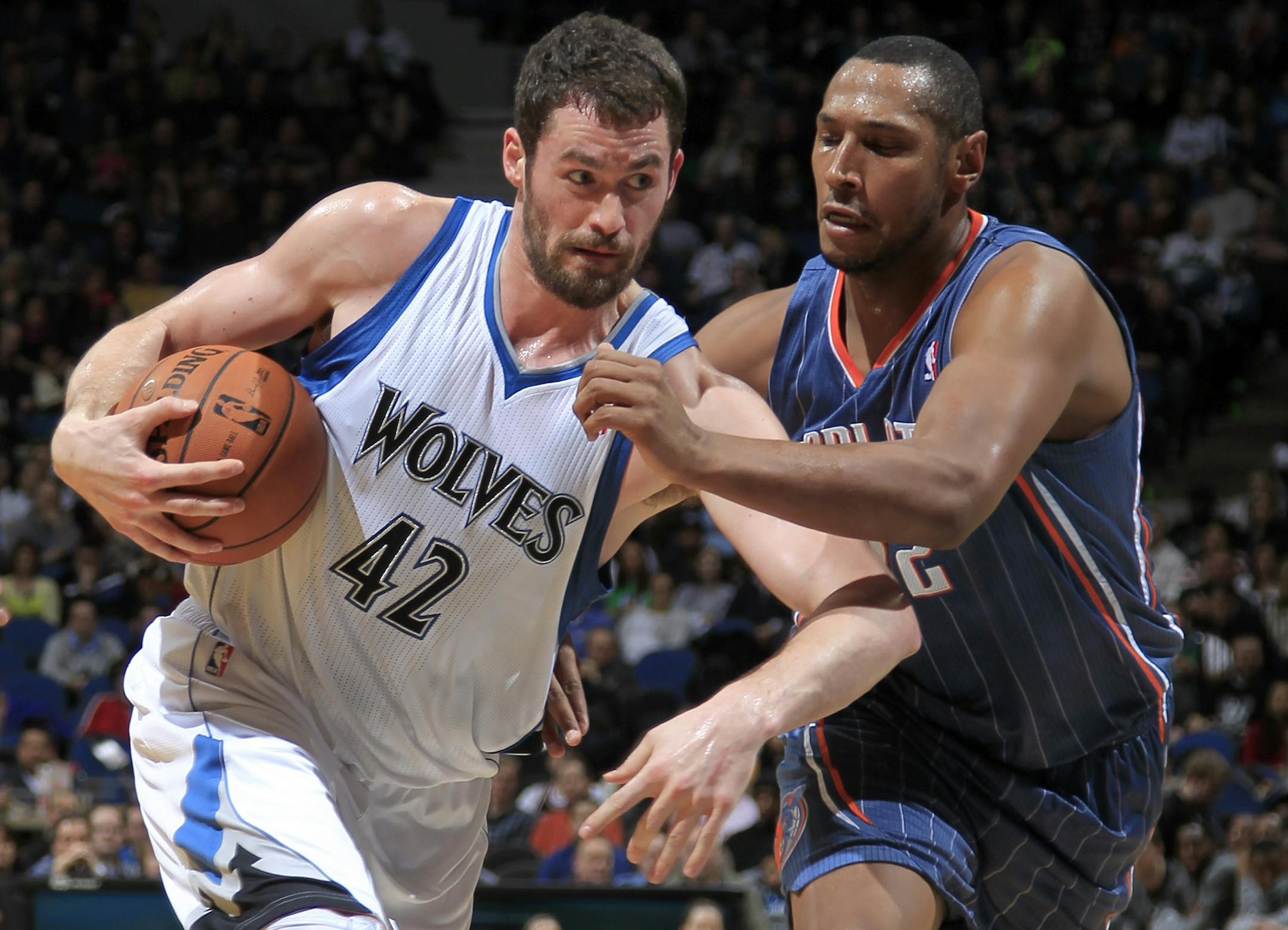 The Wolves' Kevin Love drove to the basket against Charlotte's Boris Diaw in the first quarter.