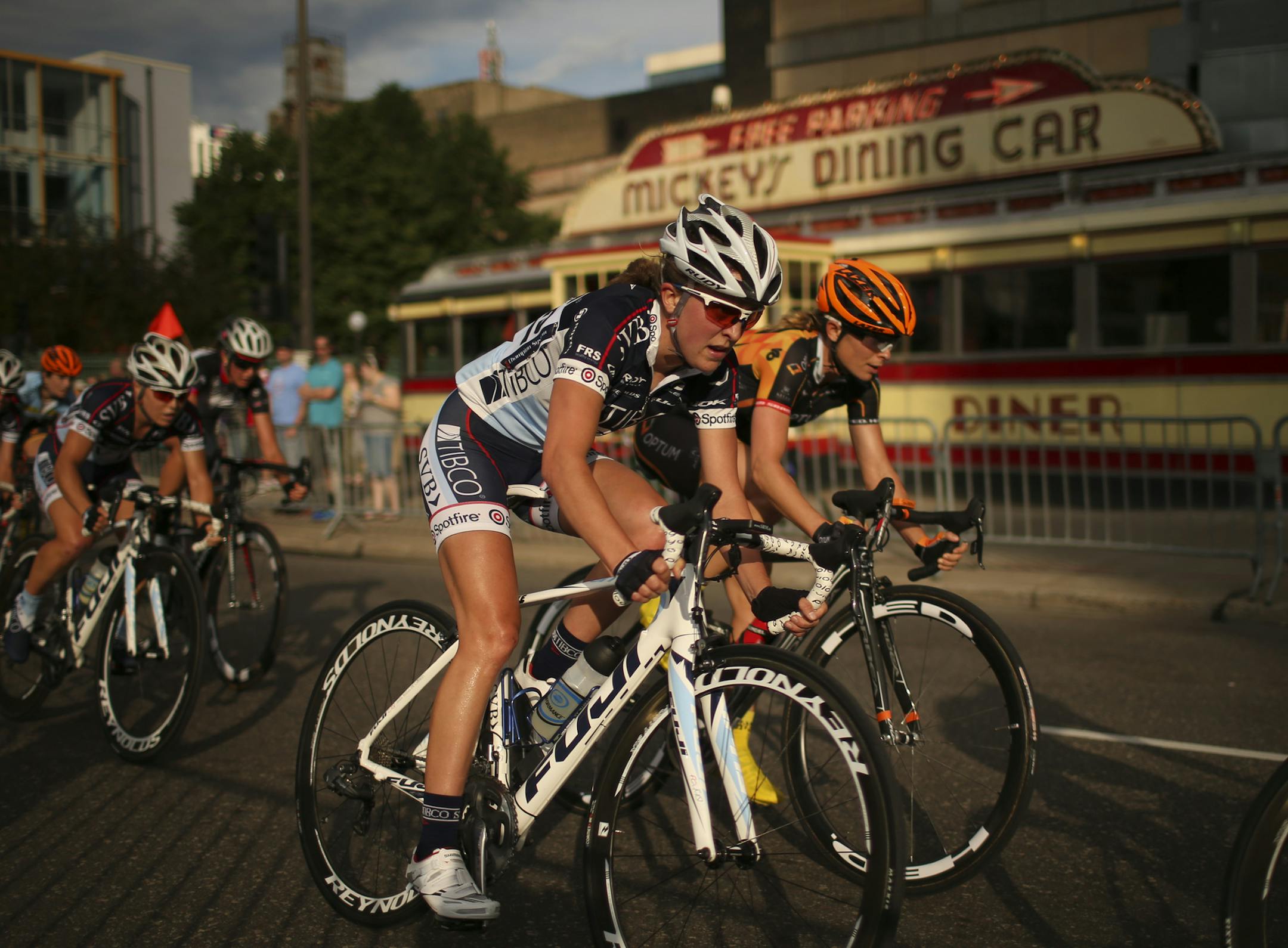 The Nature Valley Grand Prix cycling race made it's annual stop in St. Paul Wednesday evening, June 12, 2013. Team TIBCO's Amanda Miller rode alongside eventual winner Lauren Hall of Minneapolis-based Optum Pro Cycling in the middle of the race. ] JEFF WHEELER ‚Ä¢ jeff.wheeler@startribune.com ORG XMIT: MIN1306122036066395