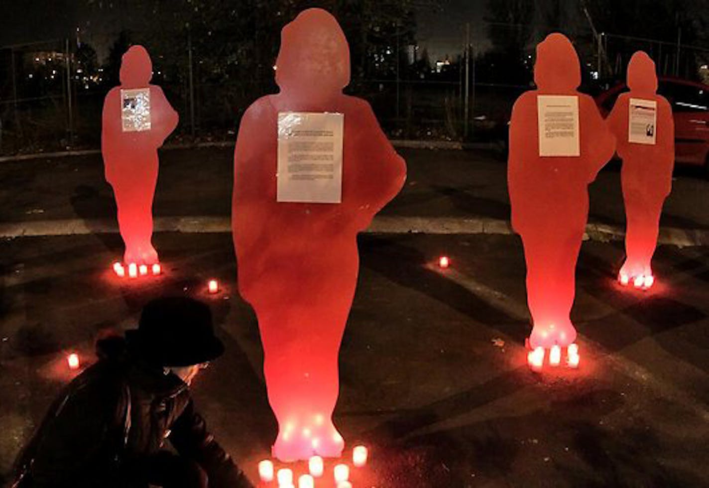 The cardboard cutouts represent women killed by domestic violence. These kinds of memorials are used around the world to raise awareness about domestic violence.