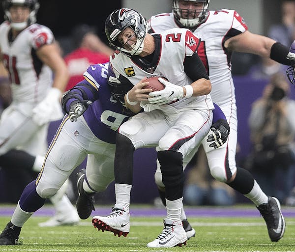 Minnesota Vikings defensive tackle Linval Joseph (98) sacked Atlanta Falcons quarterback Matt Ryan (2) in the forth quarter at U.S. Bank Stadium Sunda