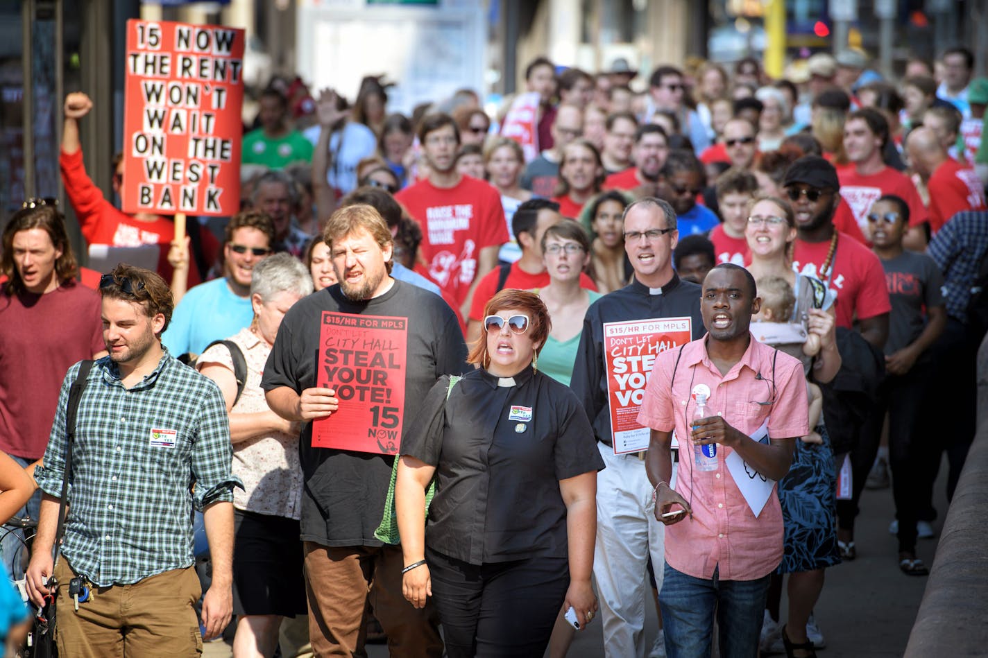 Members of 15 Now, NOC, CTUL and other groups trying to get a $15 minimum wage on the Minneapolis ballot this November headed to the Minneapolis City Council Chambers. ] GLEN STUBBE * gstubbe@startribune.com Wednesday, August 3, 2016 Members of 15 Now, NOC, CTUL and other groups trying to get a $15 minimum wage on the Minneapolis ballot this November gathered outside City Hall and marched together as a group into council chambers to press their demands.