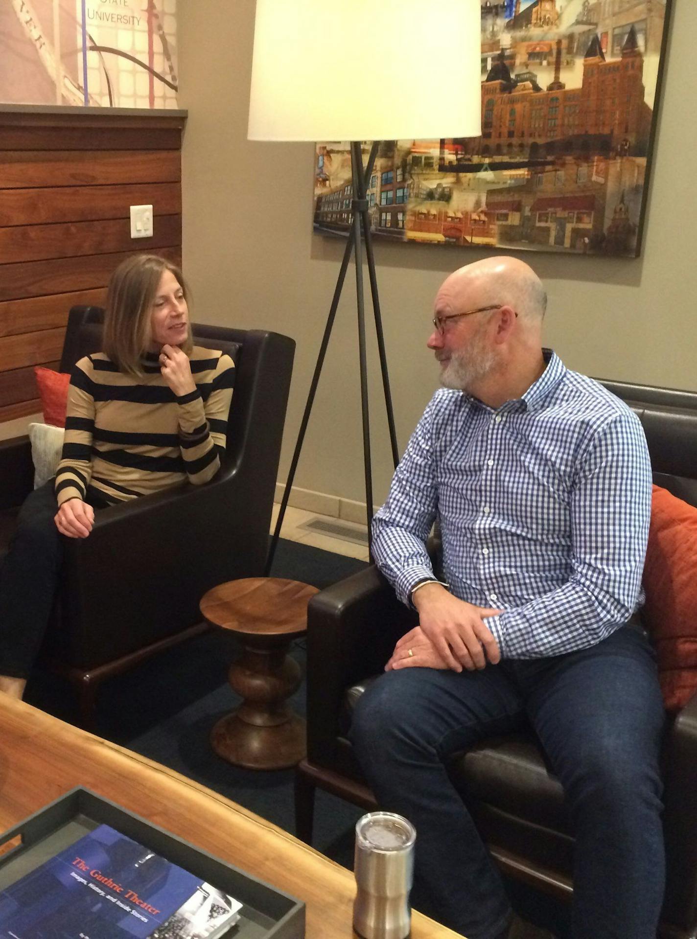 Kathy and Eric Gibson in the lobby of Miill & Main, their apartment in Mpls.