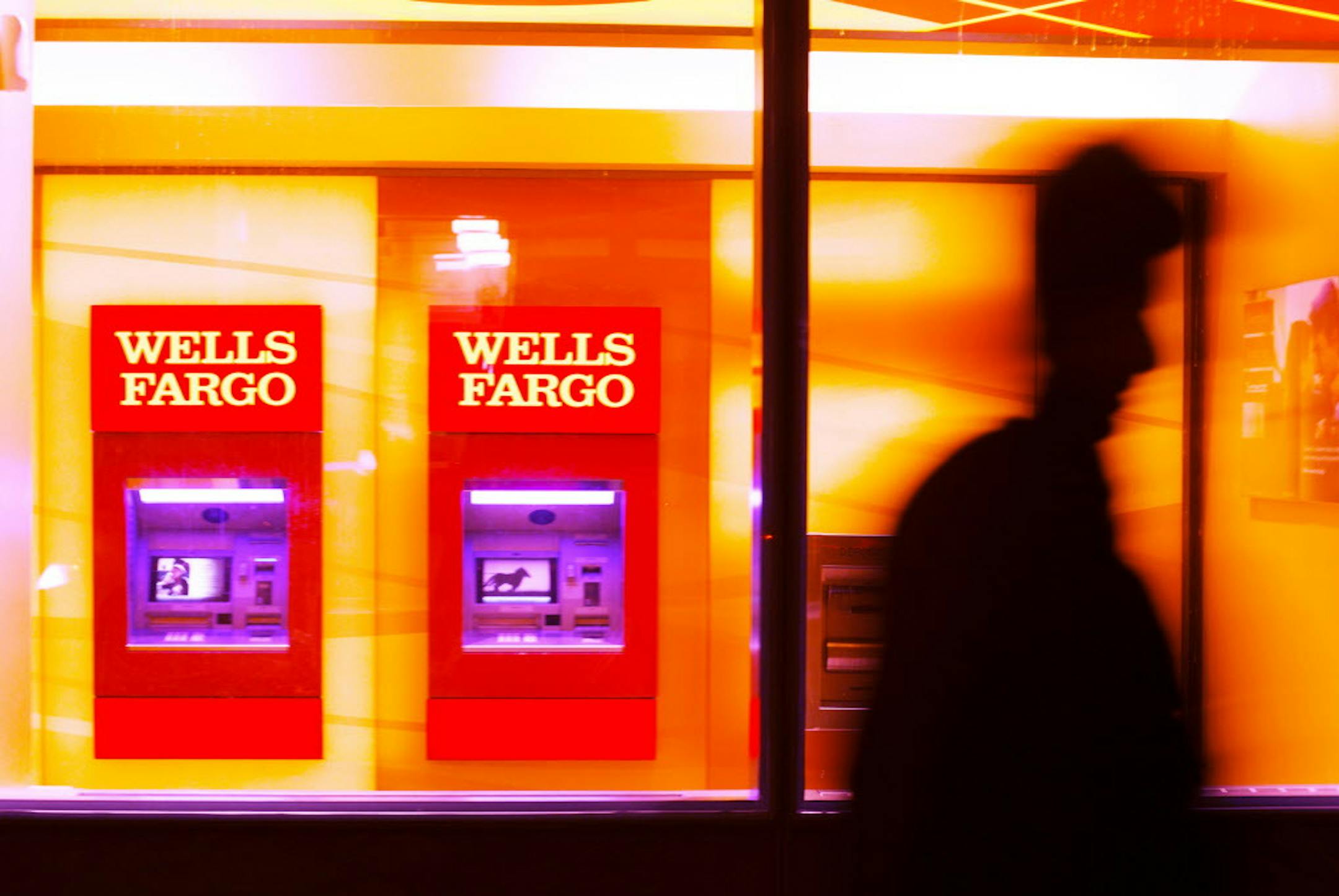 FILE ó Wells Fargo ATMs in New York, Jan. 12, 2017. The bank was ordered by a federal regulator to pay $5.4 million to a manager who was fired in 2010 after informing supervisors and a bank ethics hotline about what he thought was fraudulent behavior. (Tayler Smith/The New York Times)