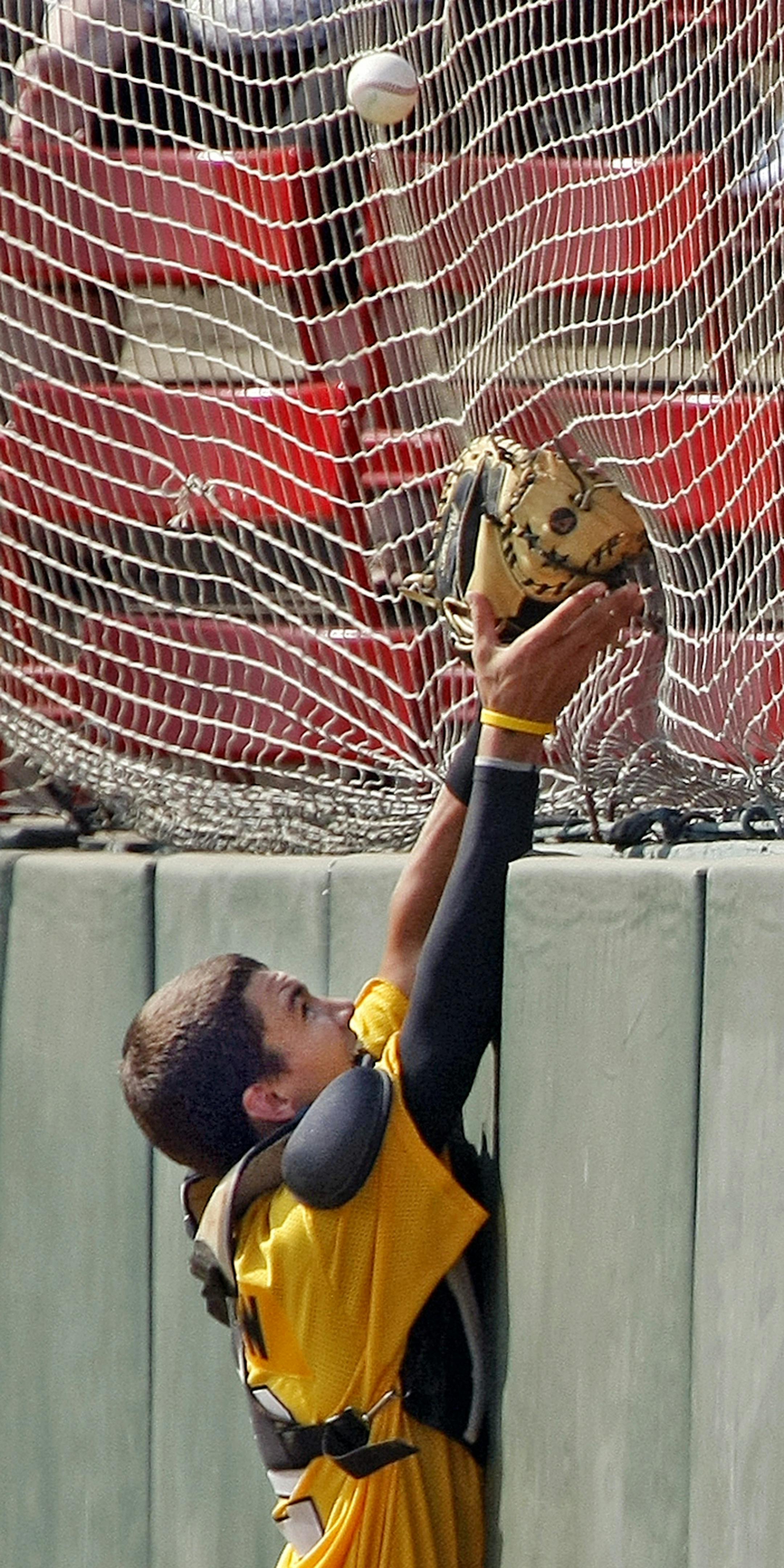 Burnsville catcher Camden Traetow reaches for a foul ball against Omaha West Monday, August 12, 2013, during the Central Plains Regional baseball tournament at Jack Williams Stadium in Fargo. David Samson / The Forum ORG XMIT: NDFAR101 ORG XMIT: MIN1308141819472750
