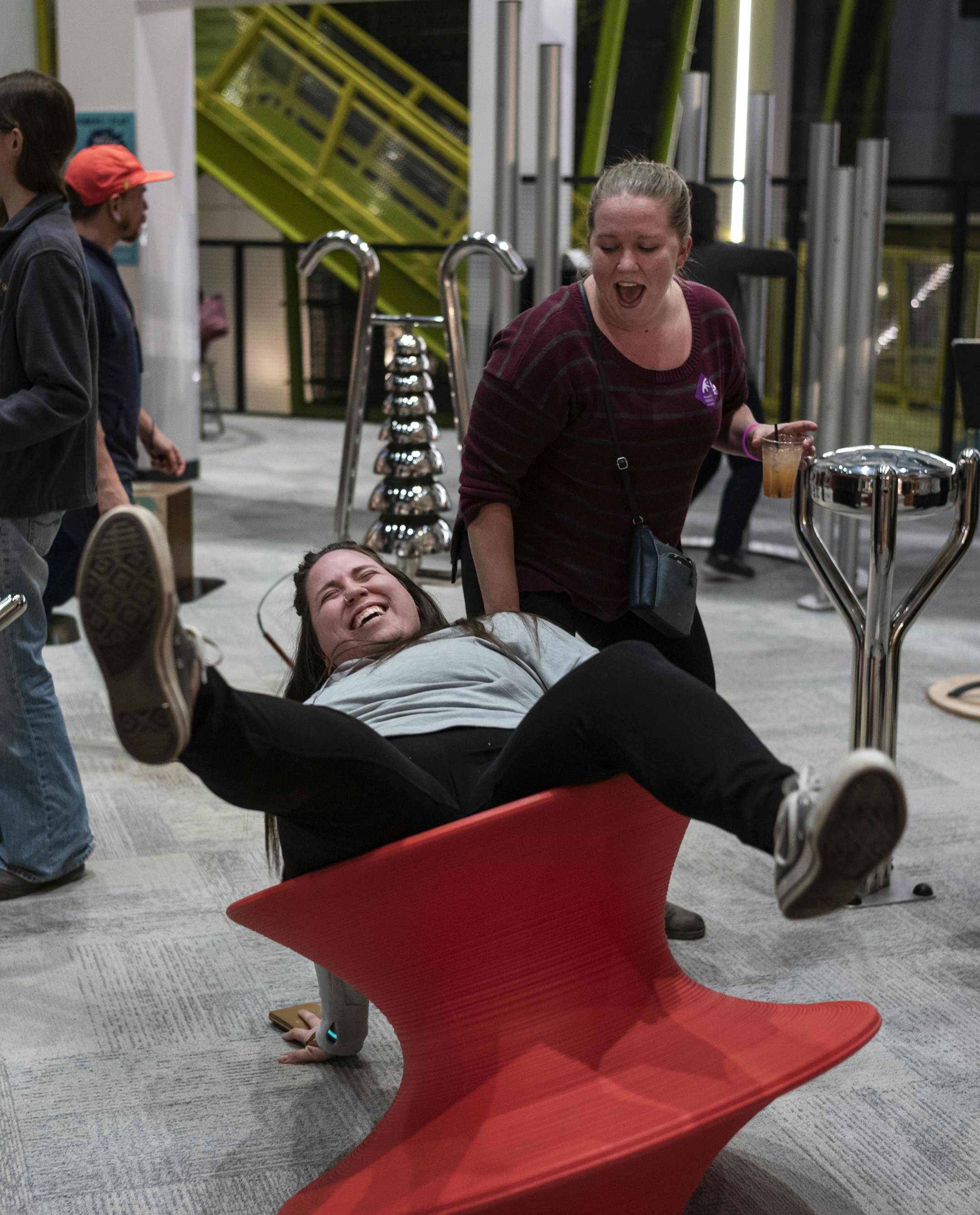 Caitlin Ronayne gets a little push from Kyah Hayek at the most recent Children's Museum event.