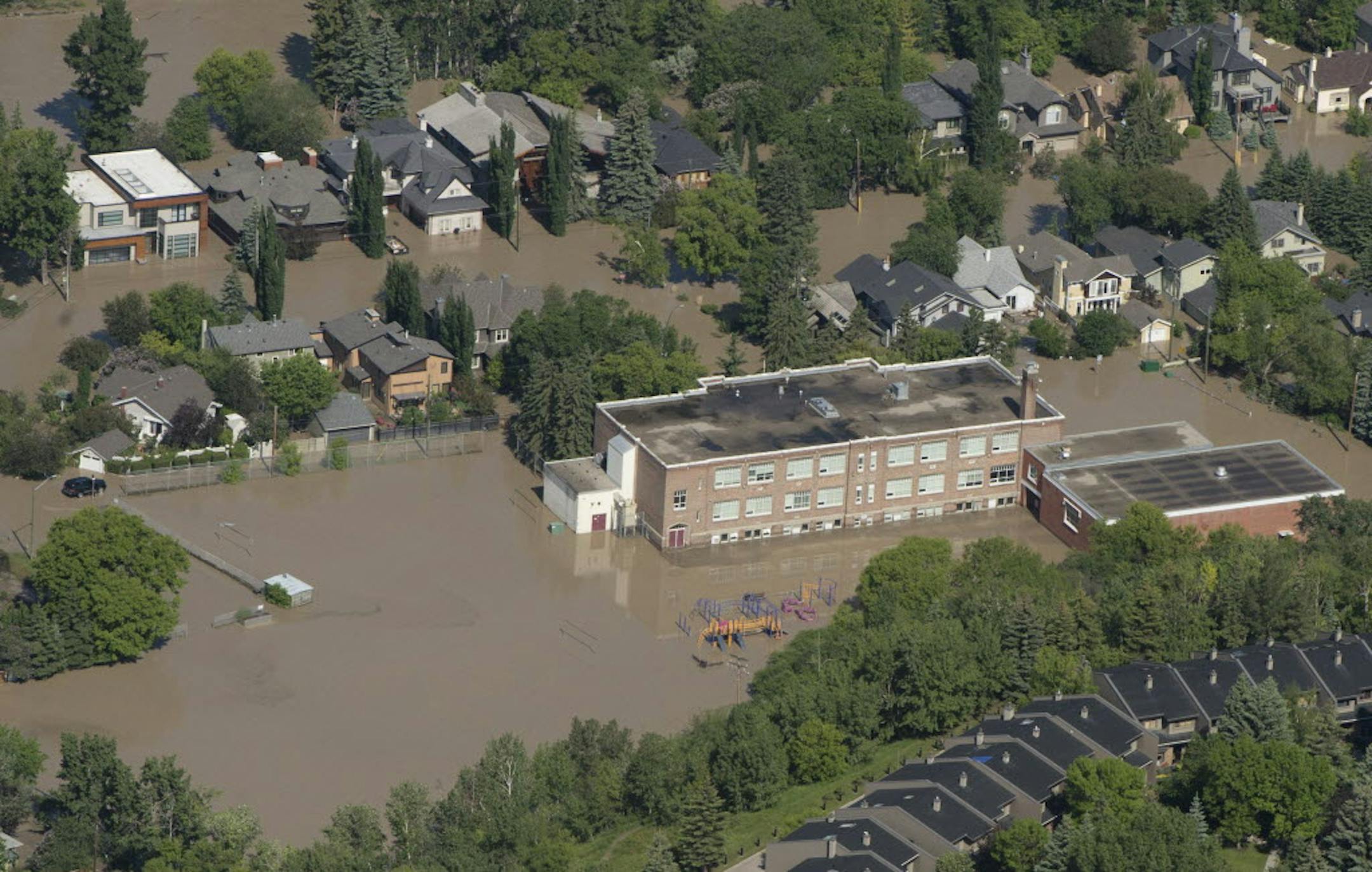 A flooded downtown Calgary, Alberta is seen from a aerial view of the city Saturday.
