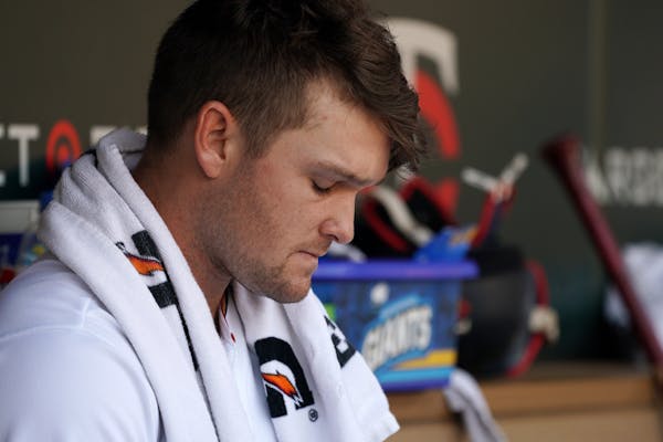 Minnesota Twins pitcher Kohl Stewart (53) sat in the dugout after losing to the Atlanta Braves.