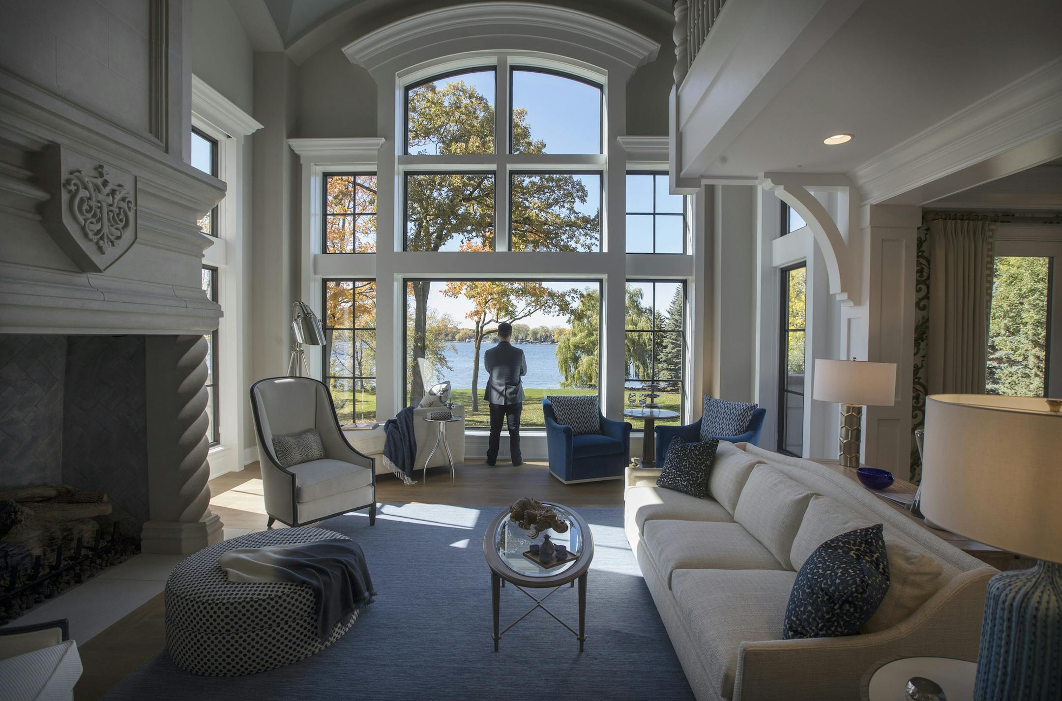 The showcase home's great room, designed by Bonnie Birnbaum and Diane Lumpkin, features two-story windows to capture Lake Minnetonka views.