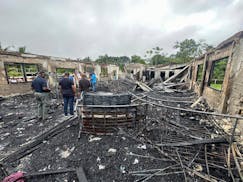The dormitory of a secondary school is burned in Mahdia, Guyana, Monday, May 22, 2023.